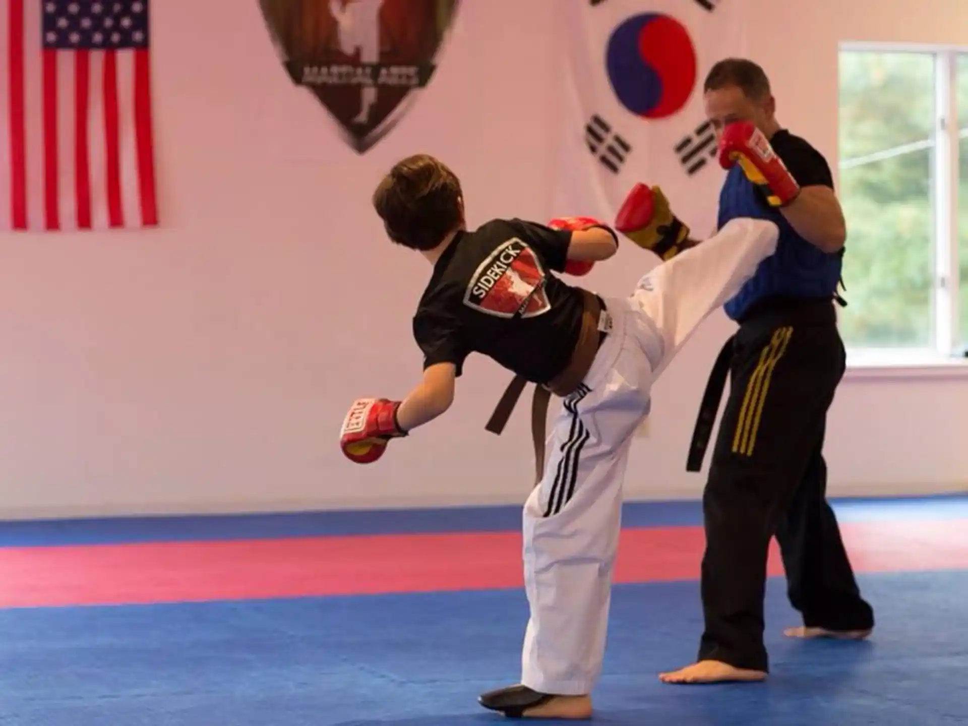 a group of men in a martial arts class