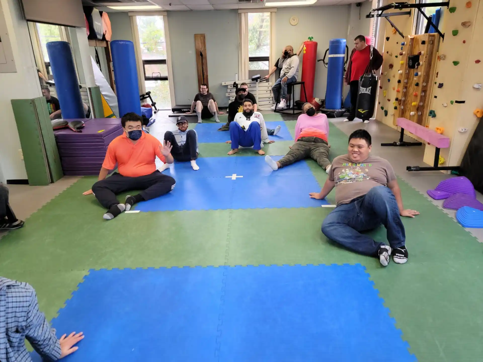 a group of people sitting on the floor