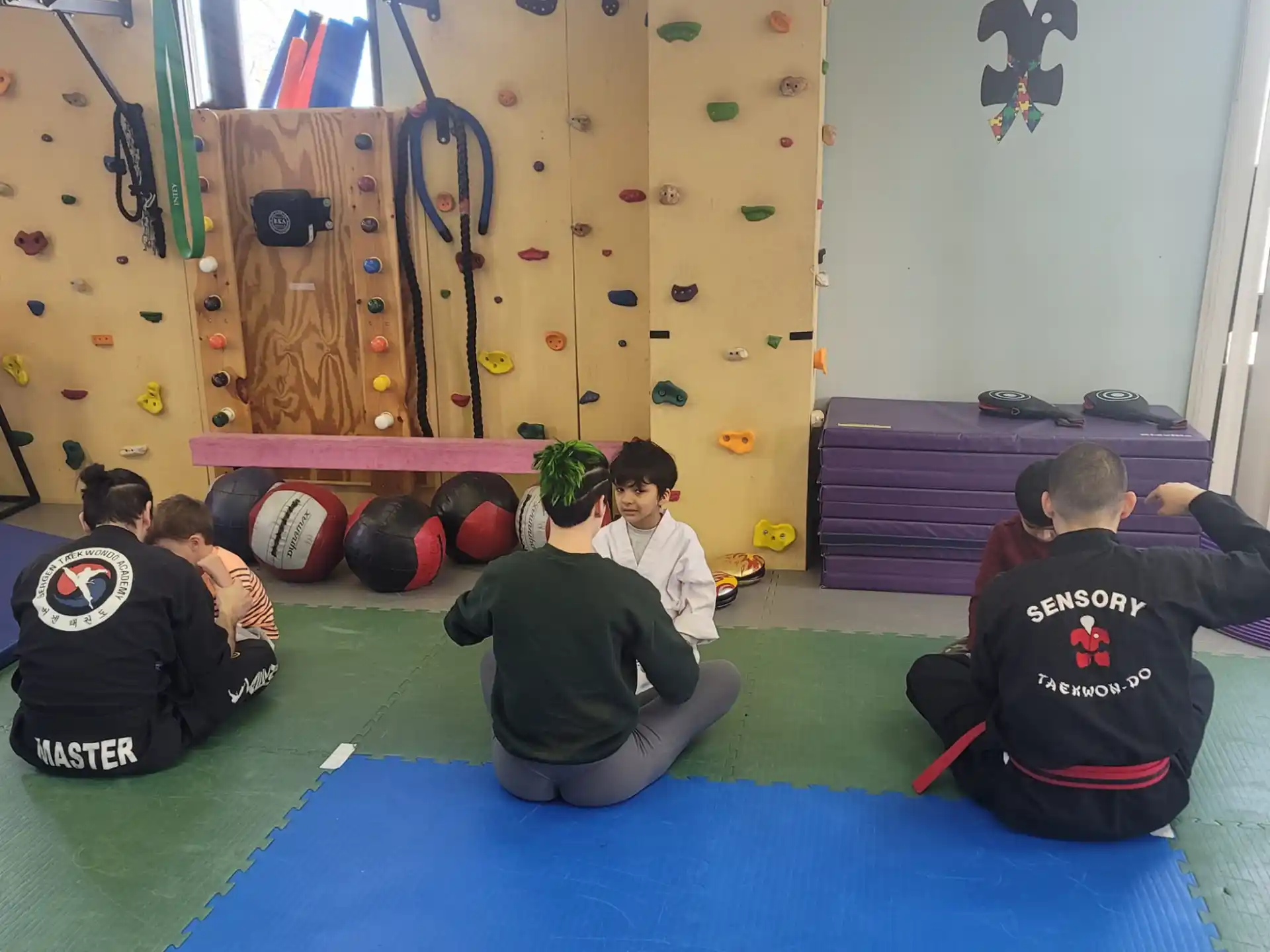 a group of people sitting on the floor