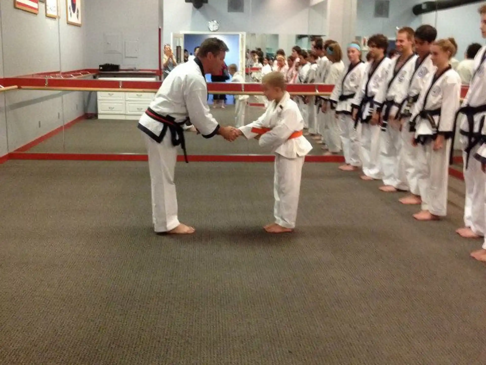 a group of people in karate uniforms
