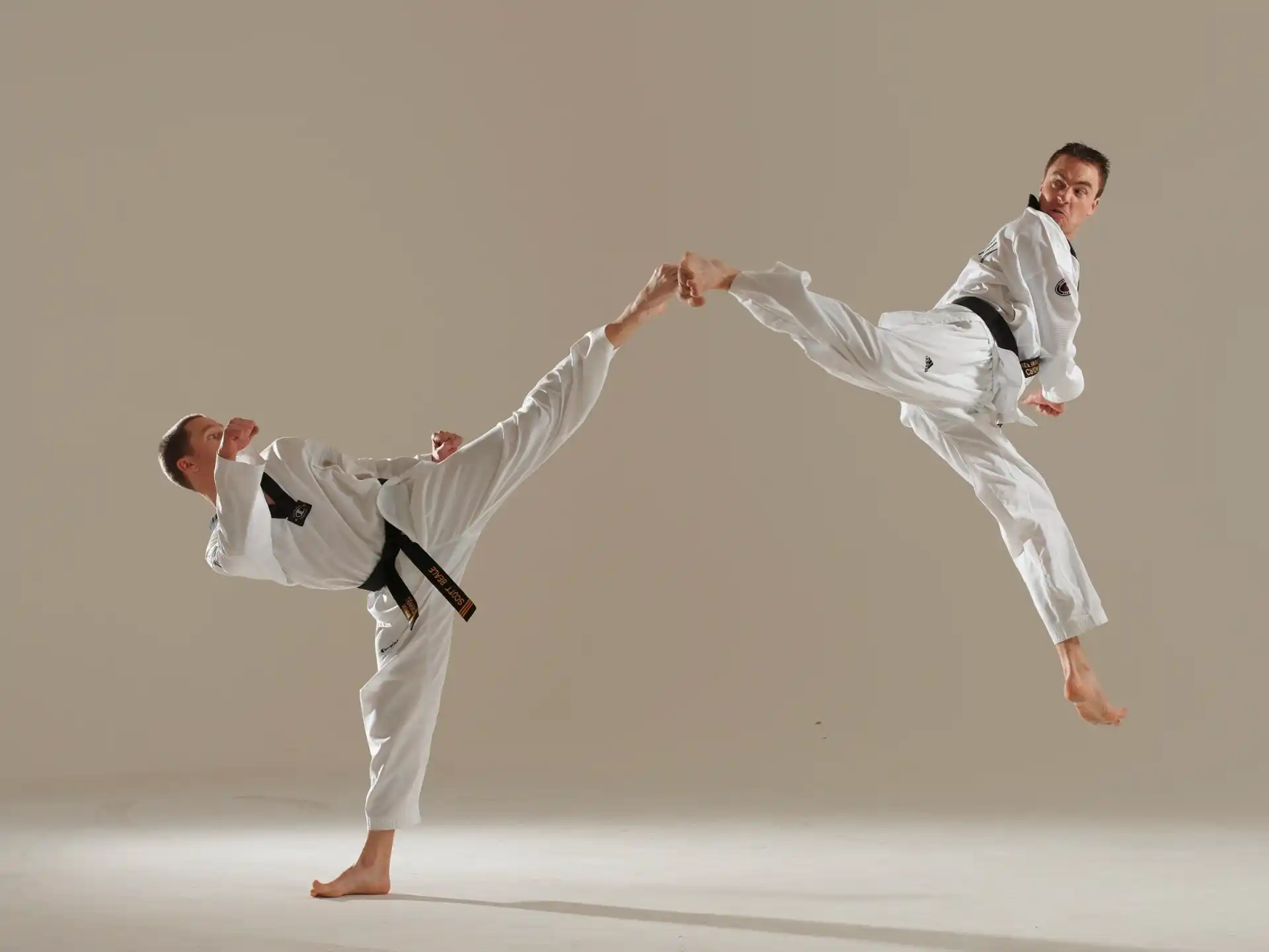 a man and a woman in karate uniforms