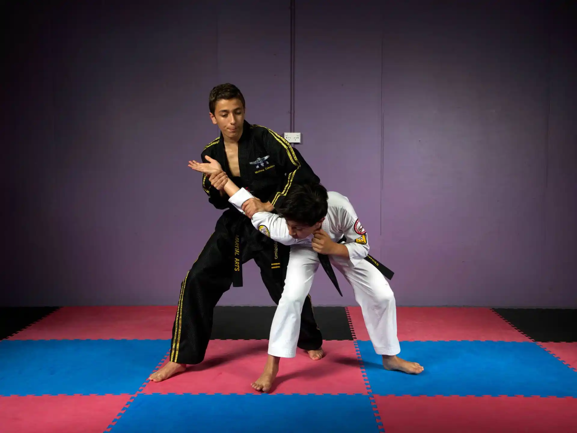 a person kicking another man in the face