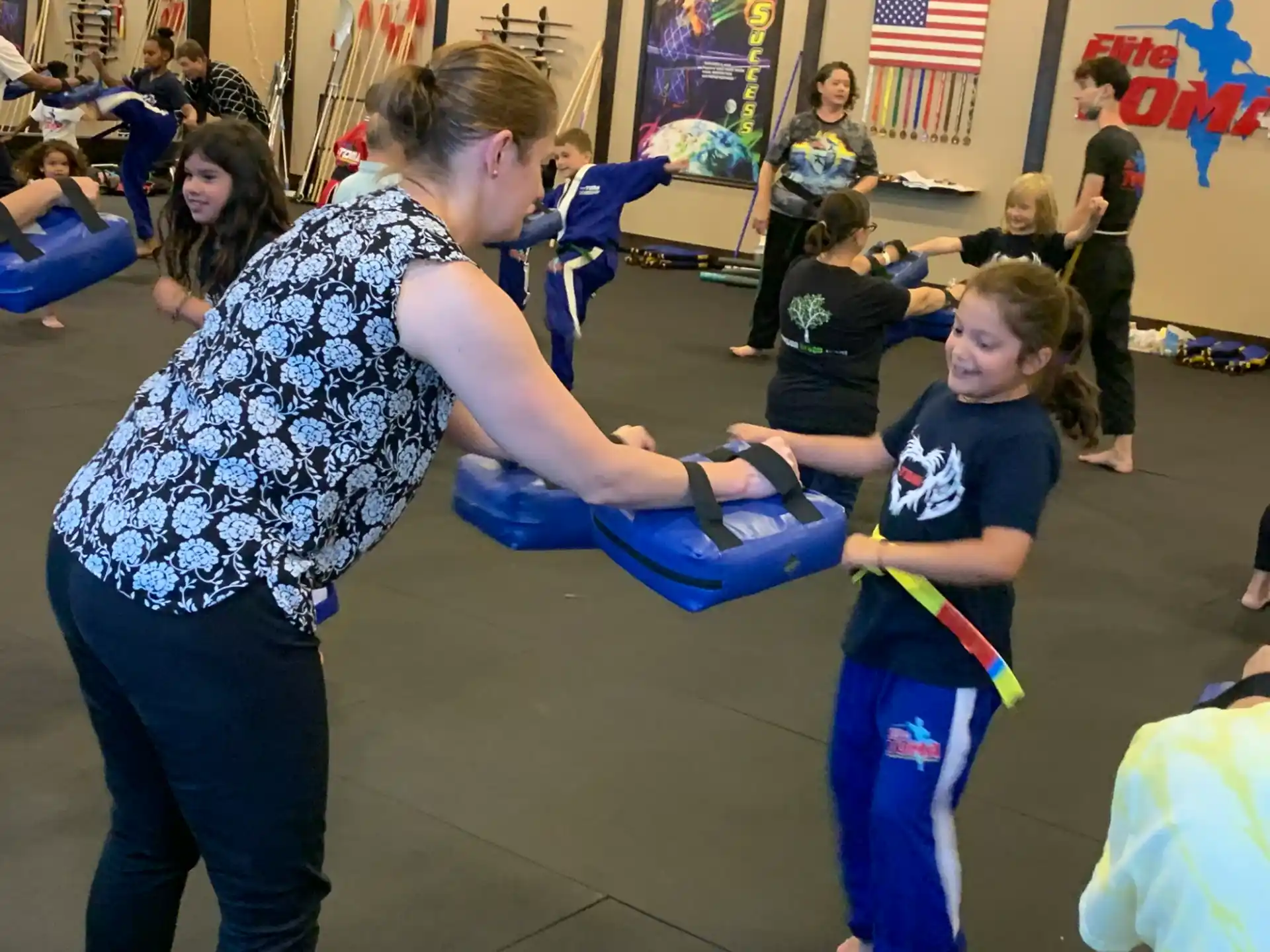 a person helping a child with a toy
