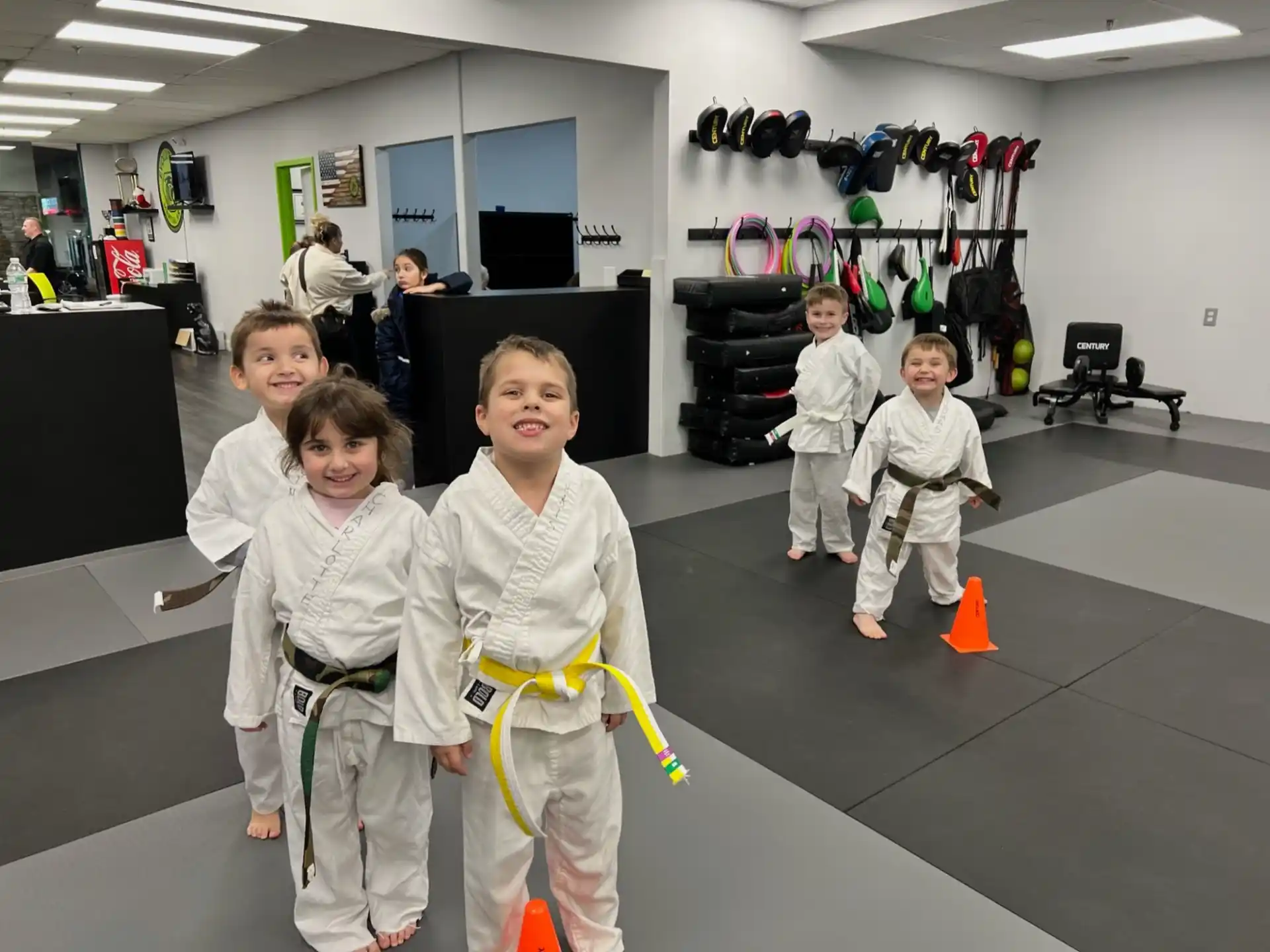 a group of children in karate uniforms