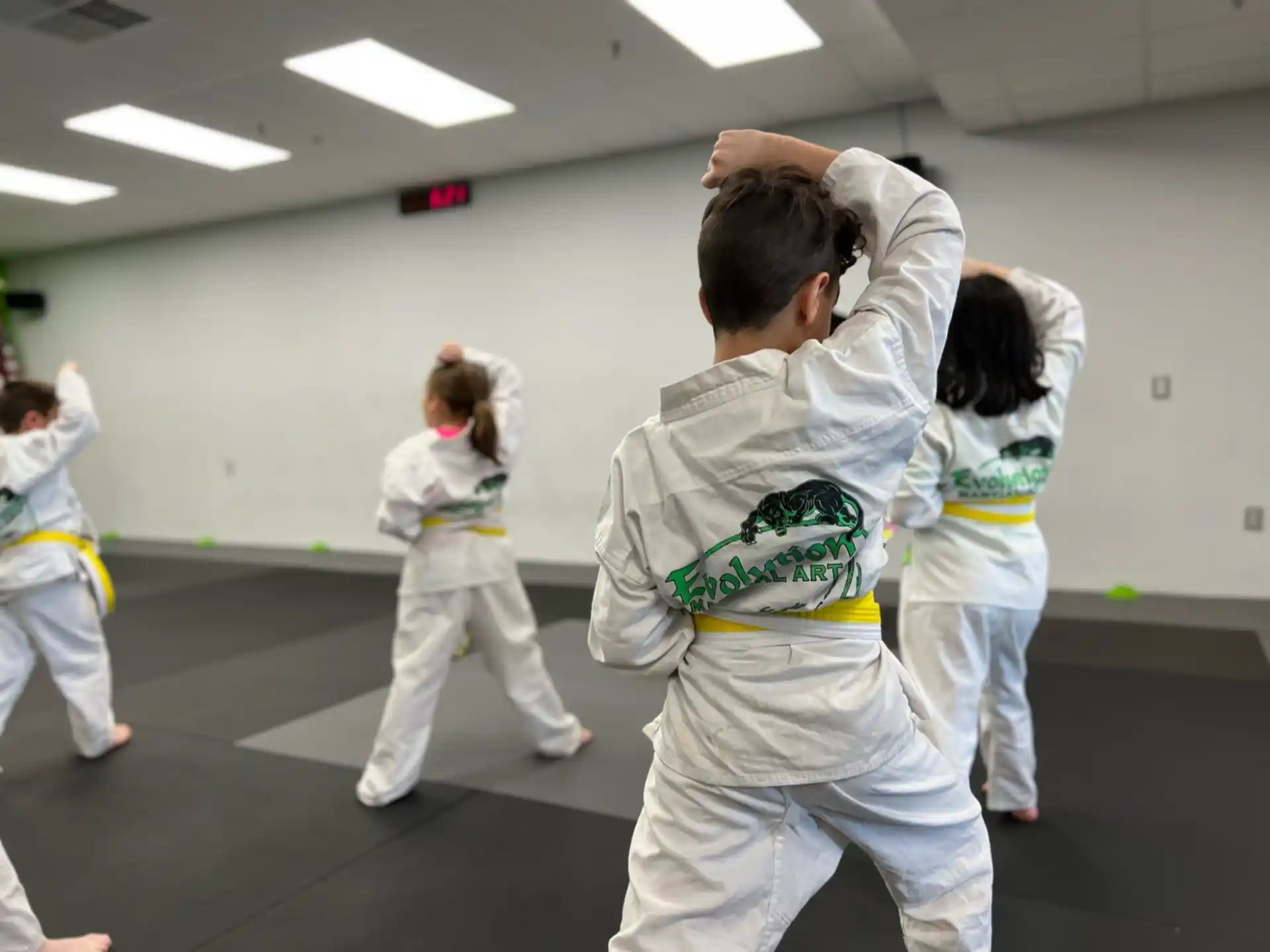 a group of people in karate uniforms