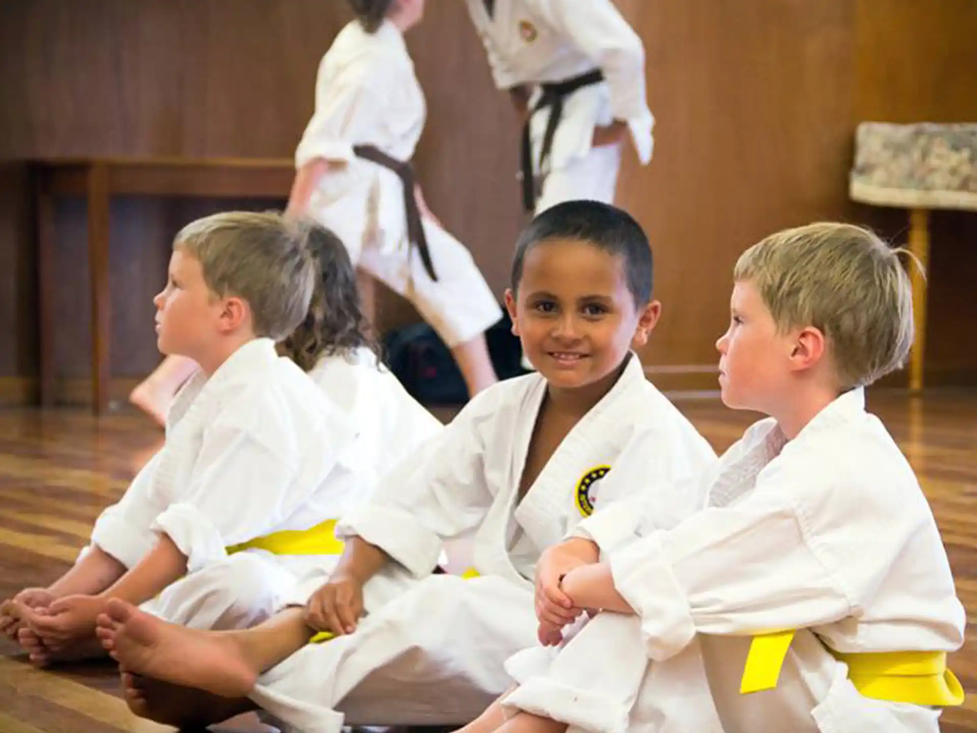 a group of boys in karate uniforms
