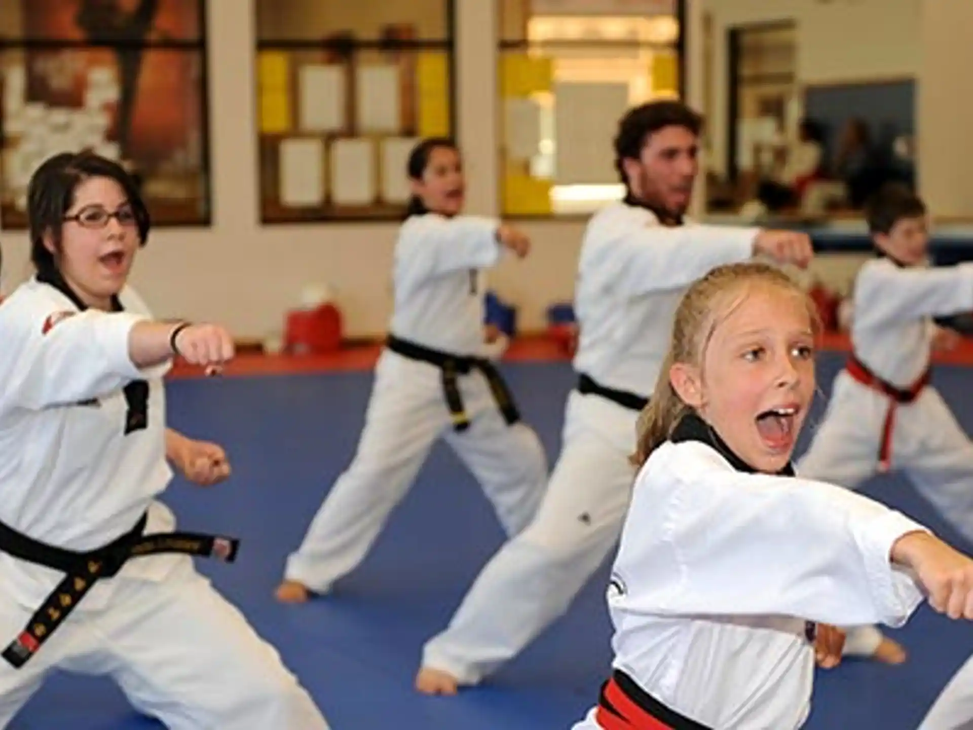 a group of people in karate uniforms