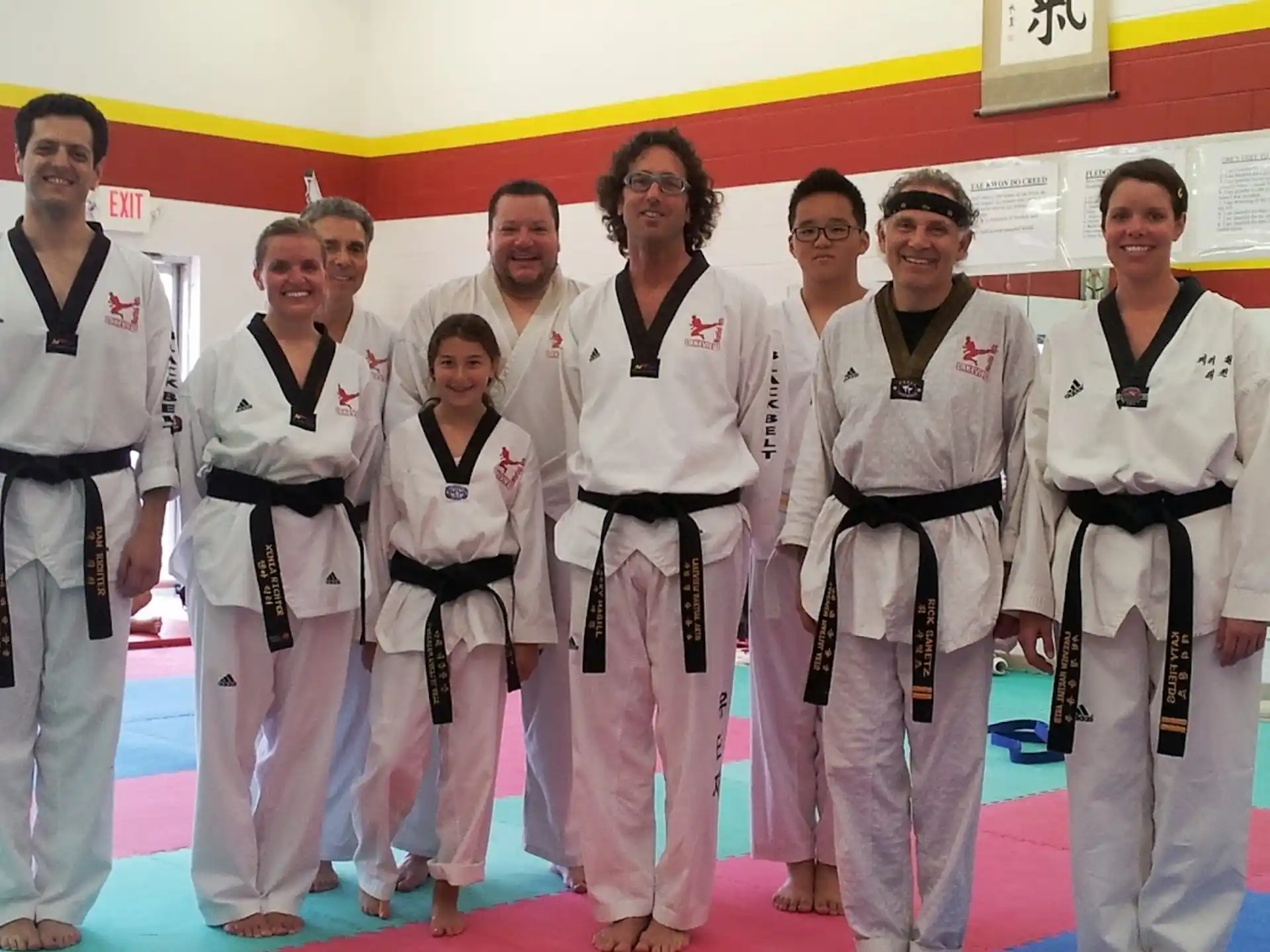 a group of people in karate uniforms