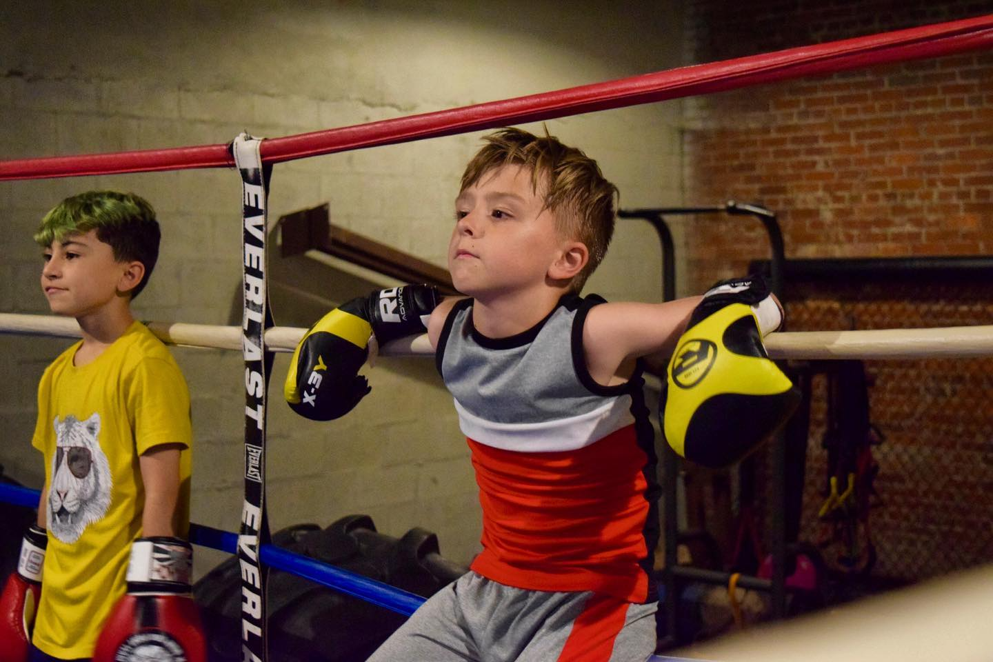a boy in a boxing ring