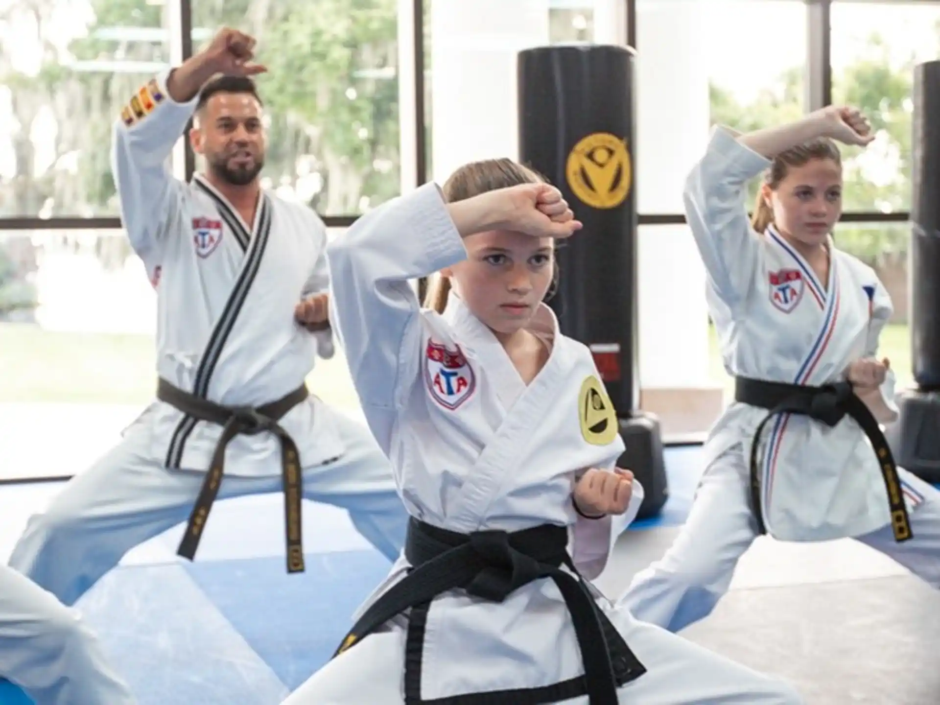 a group of people in karate uniforms