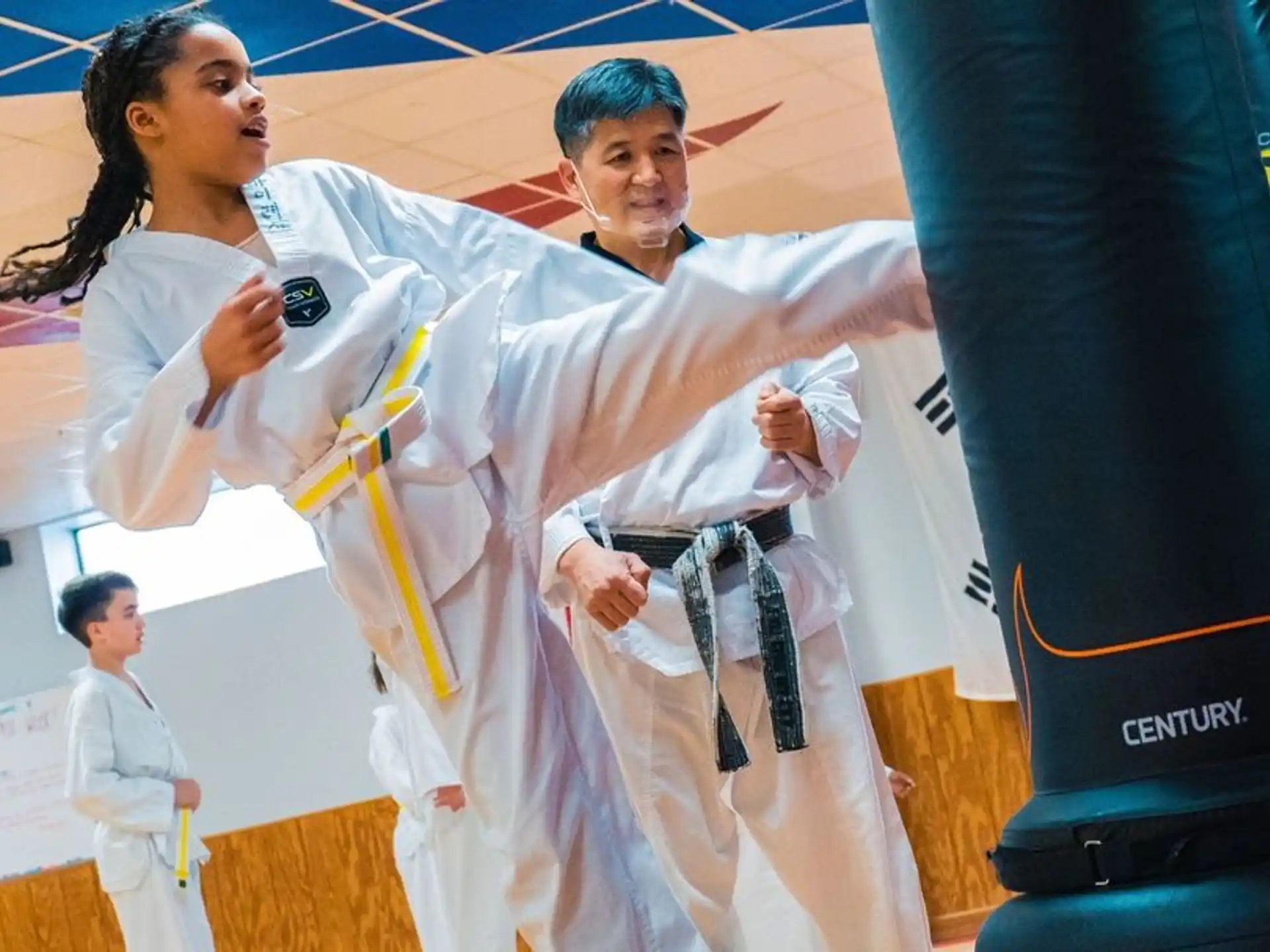 a man and woman in karate uniforms