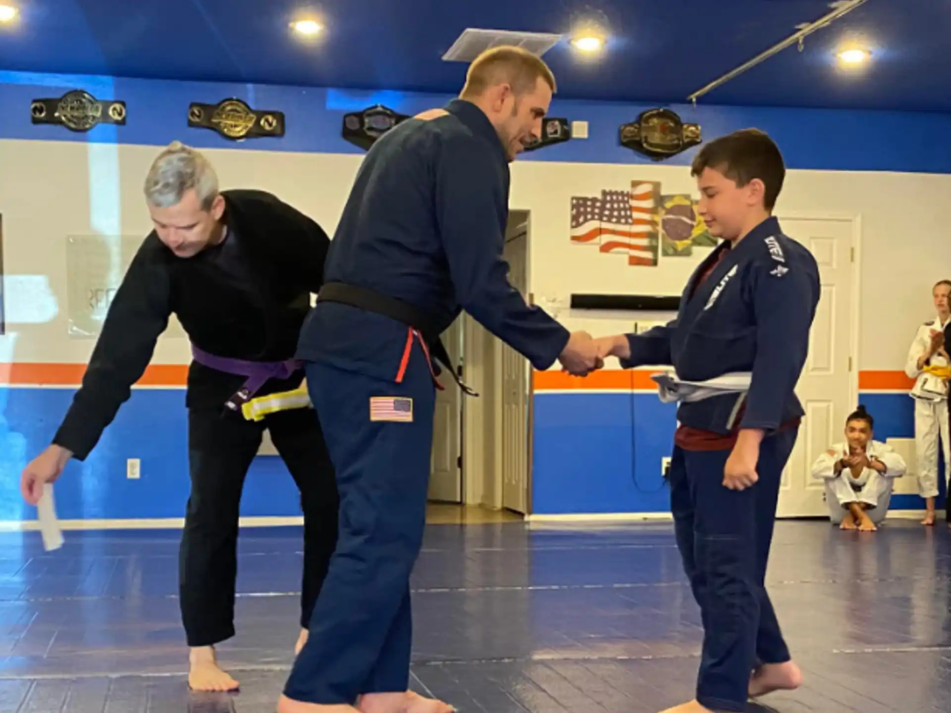 a group of people in karate uniforms