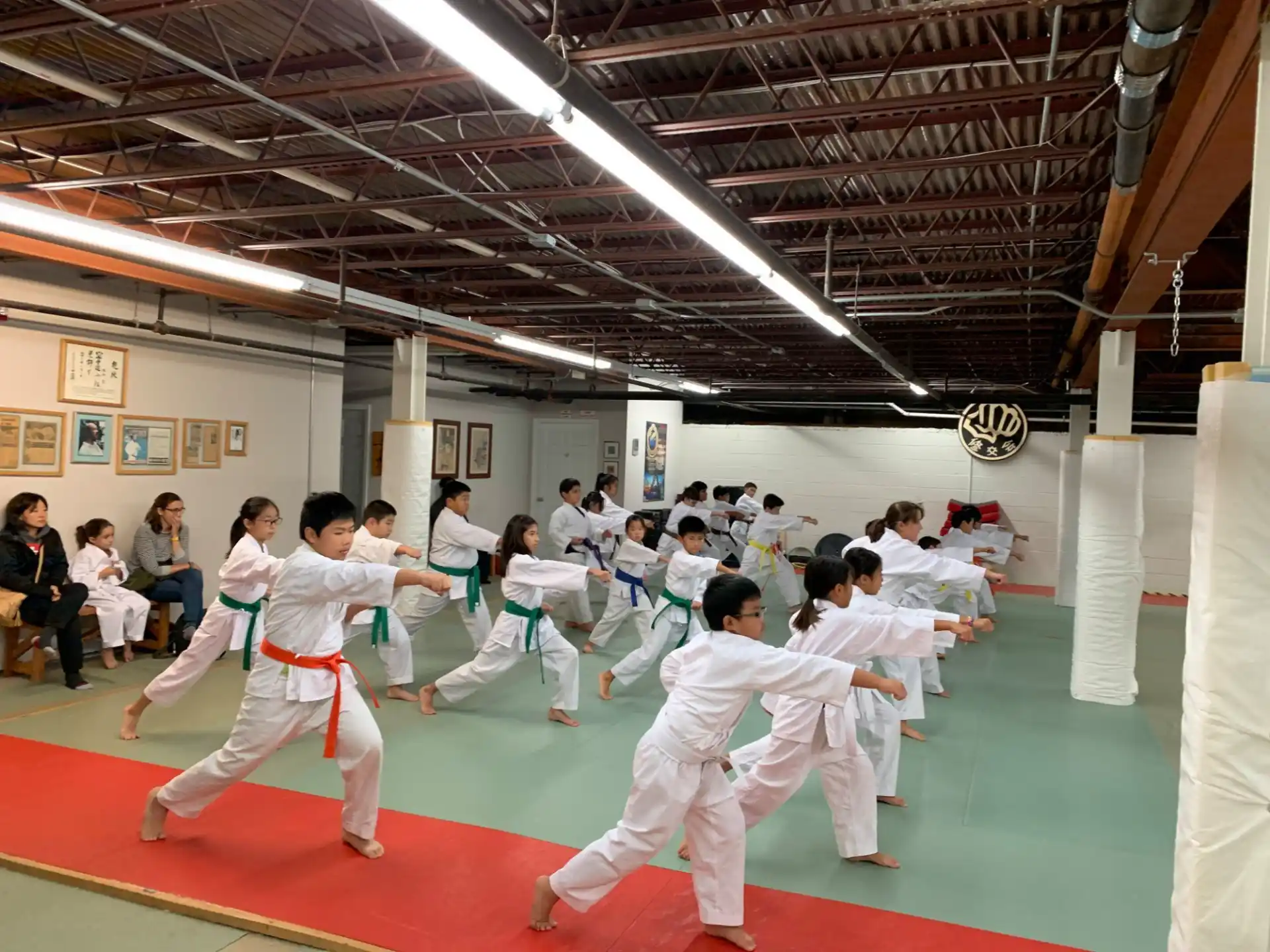 a group of people in karate uniforms