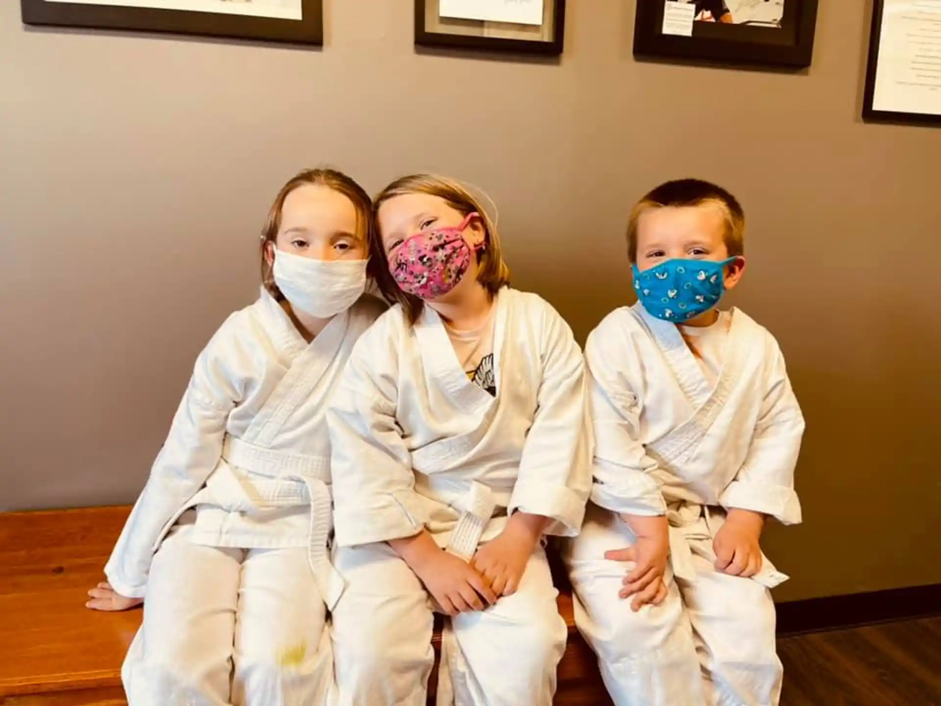 a group of children wearing face masks