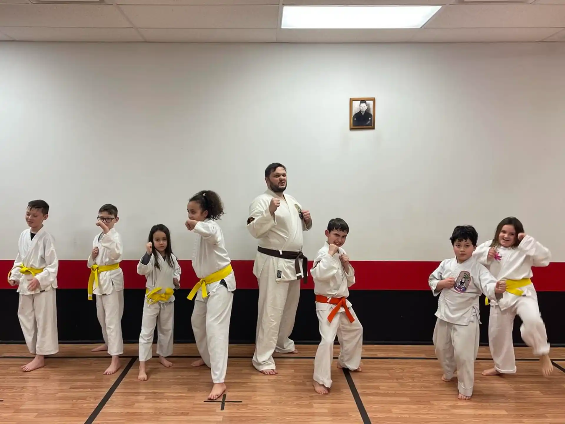 a group of people in karate uniforms