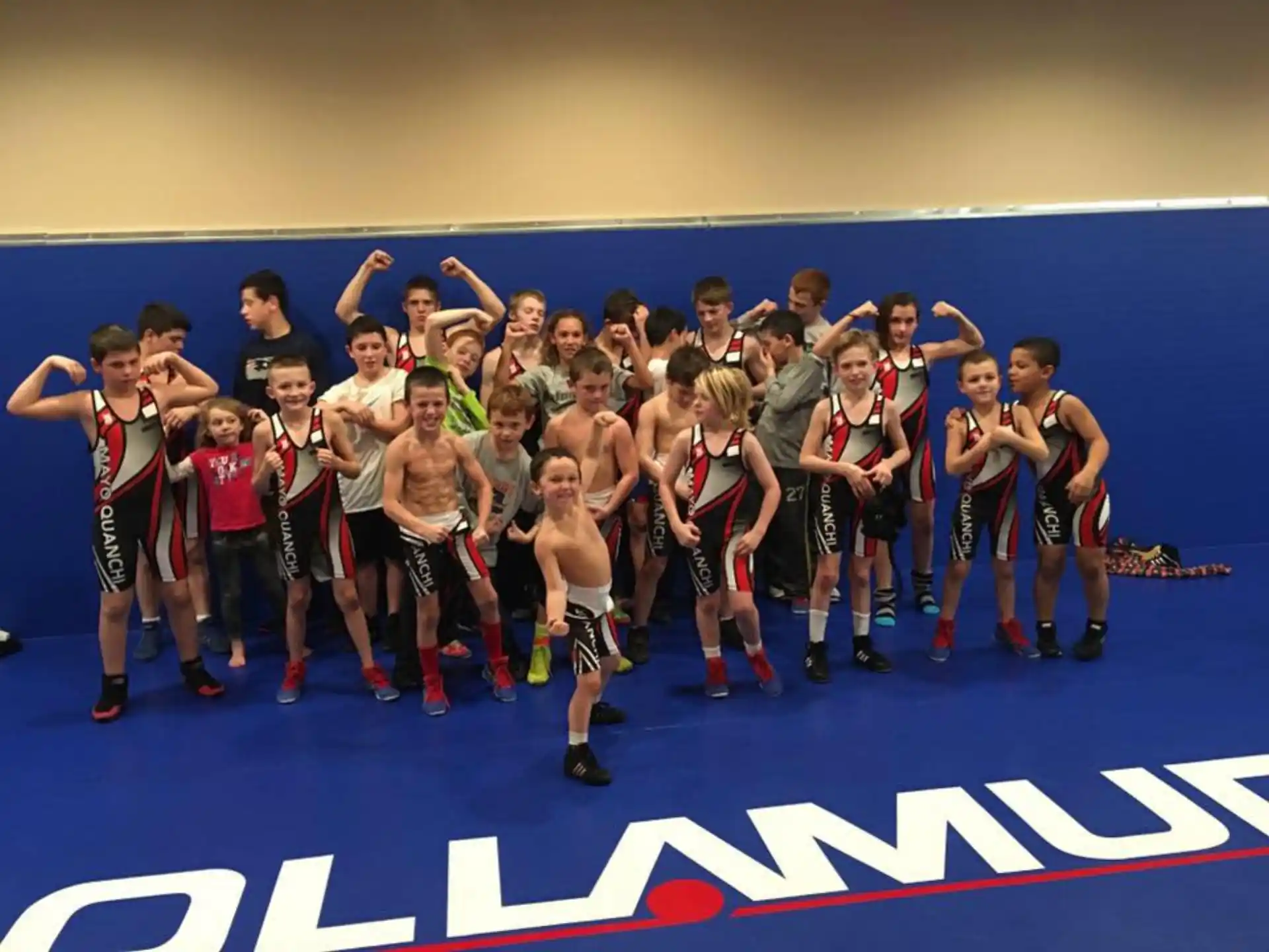 a group of athletes posing for a picture