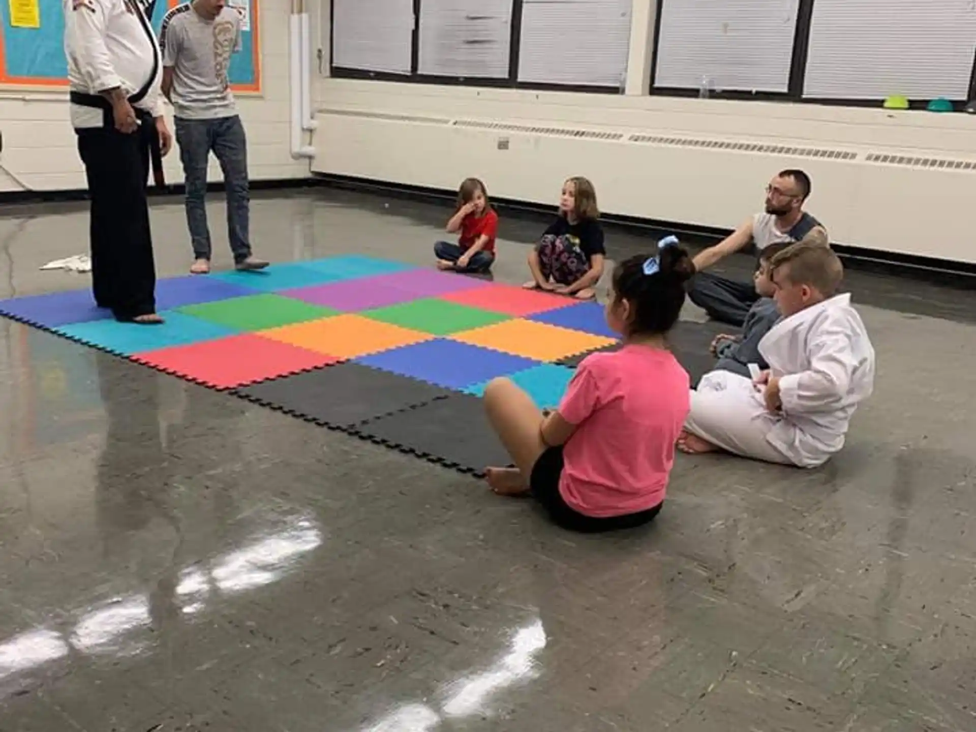 a group of people sitting on the floor