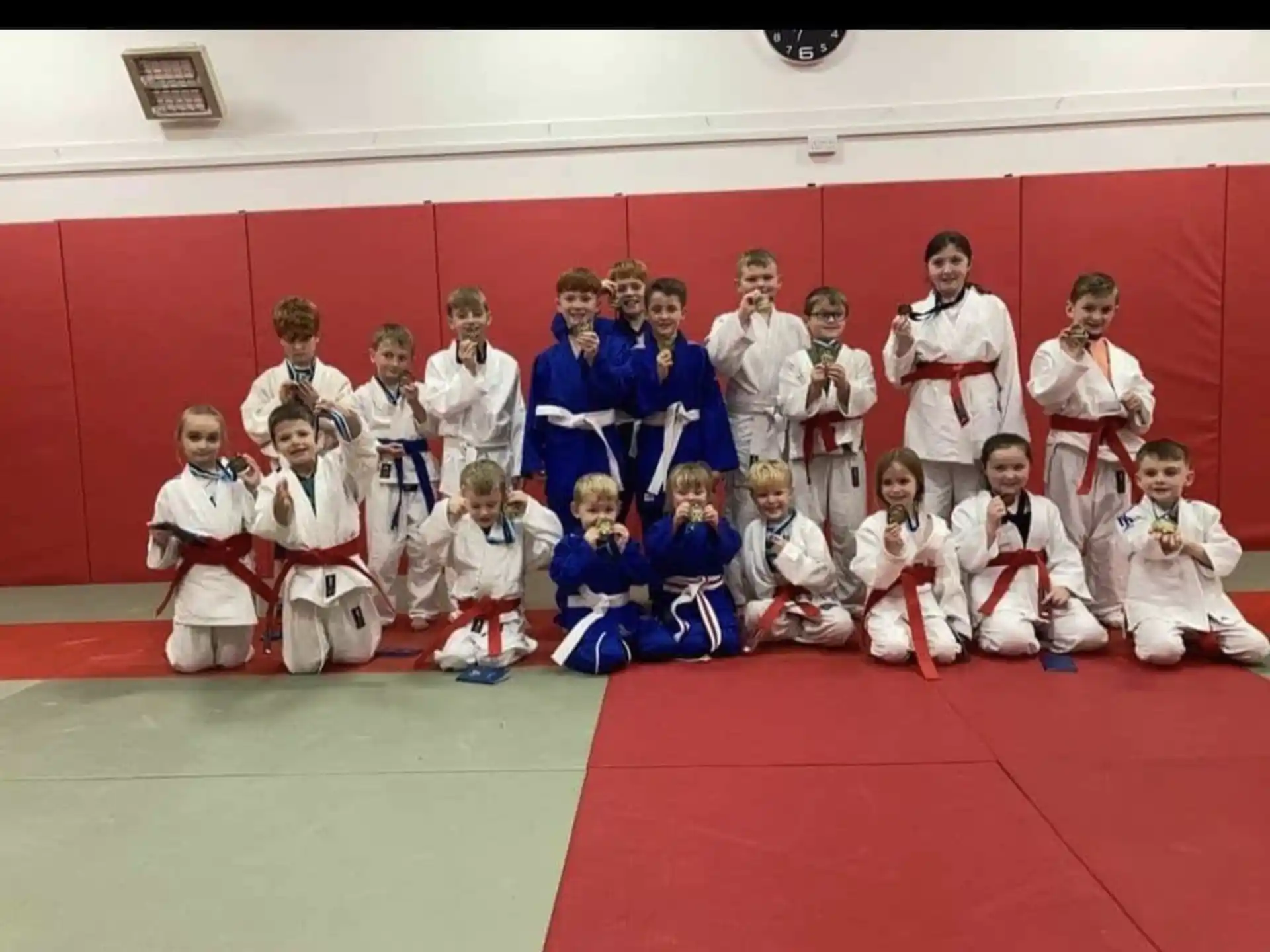 a group of people in karate uniforms