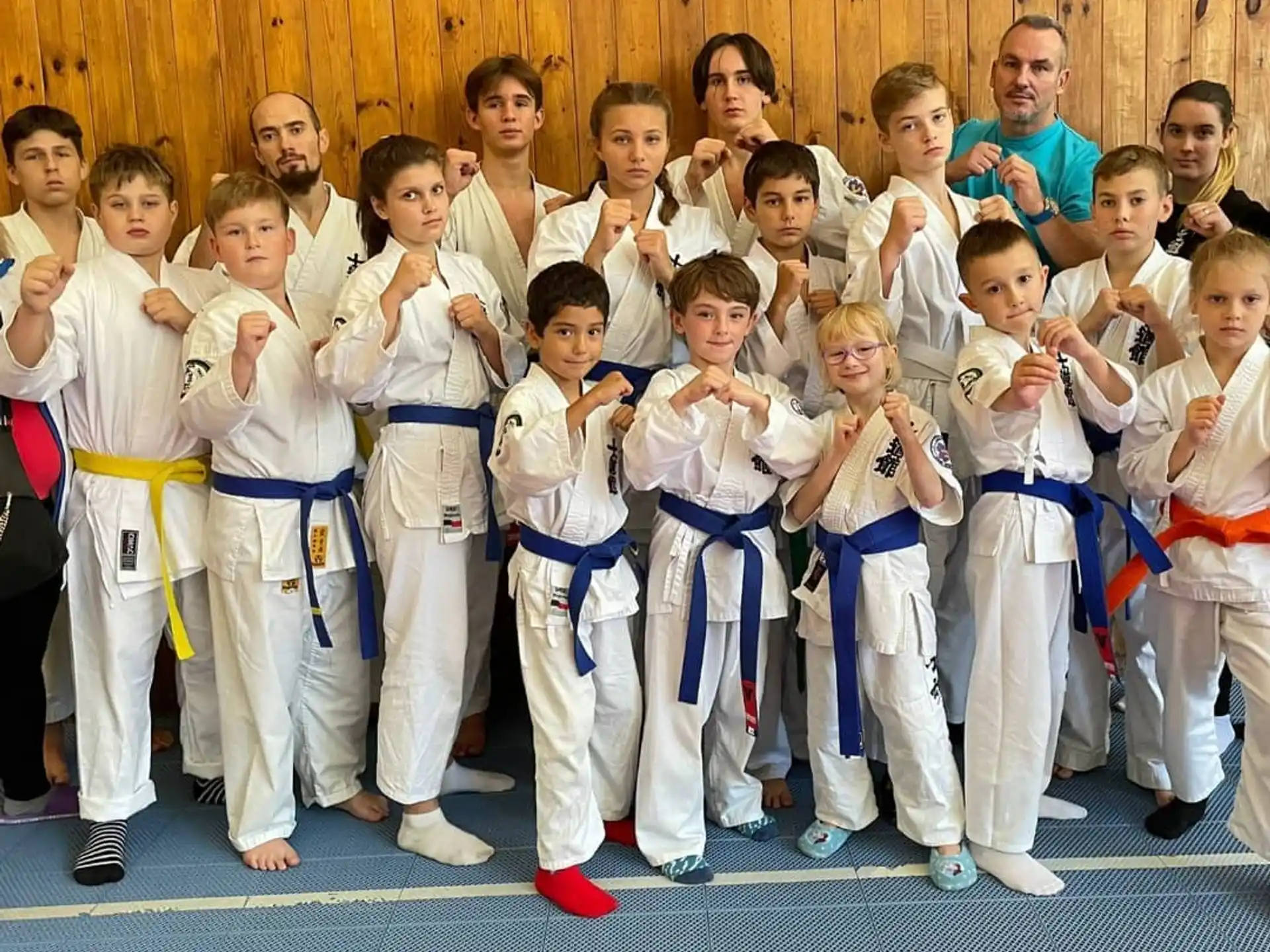 a group of people in karate uniforms