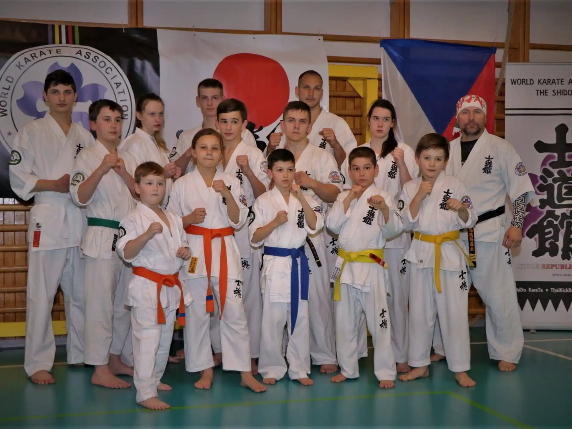 a group of people in karate uniforms