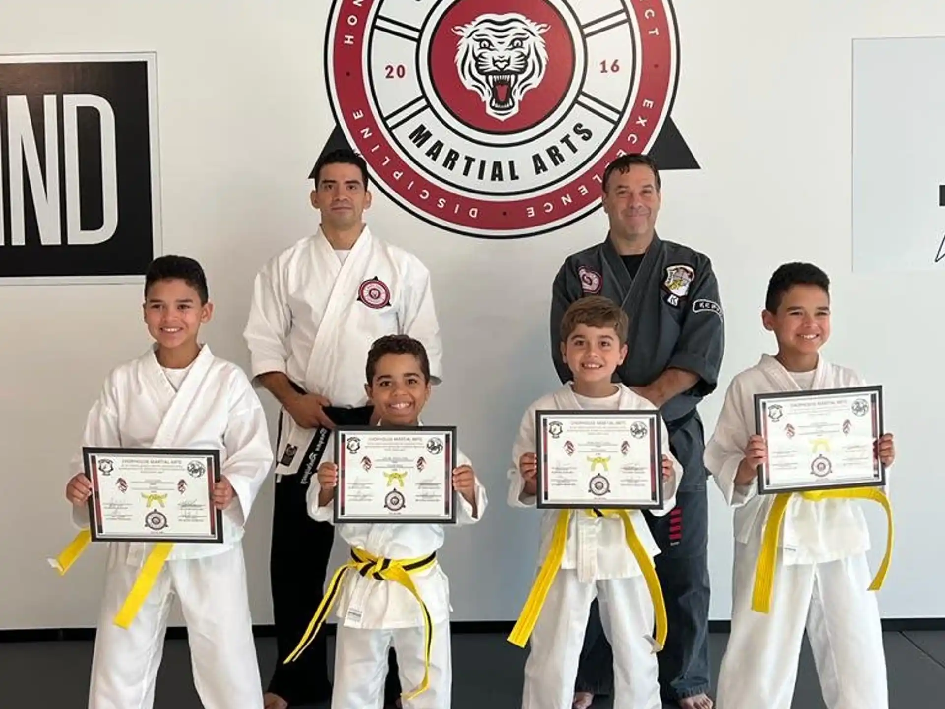 a group of people in karate uniforms