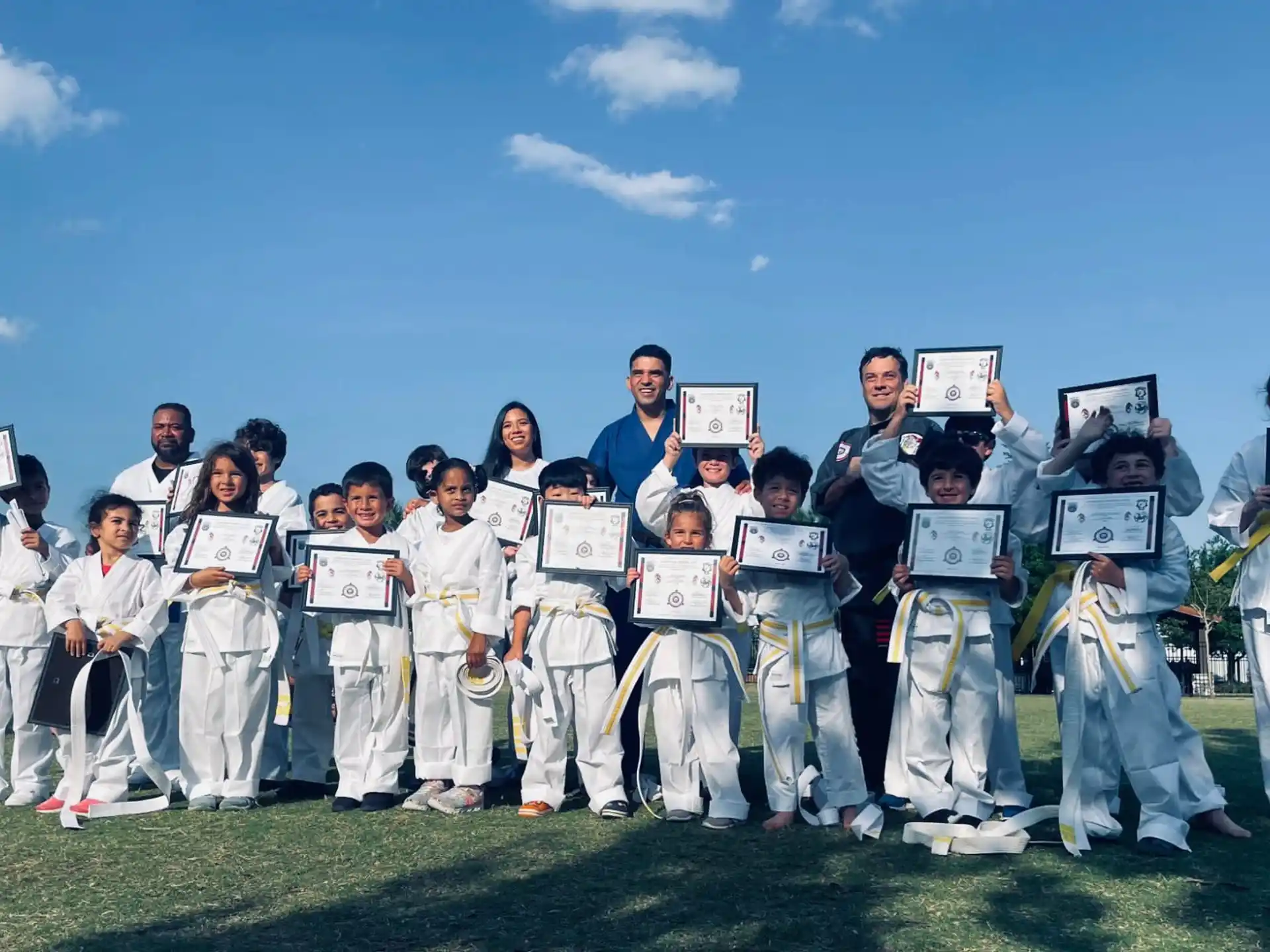 a group of people in karate uniforms
