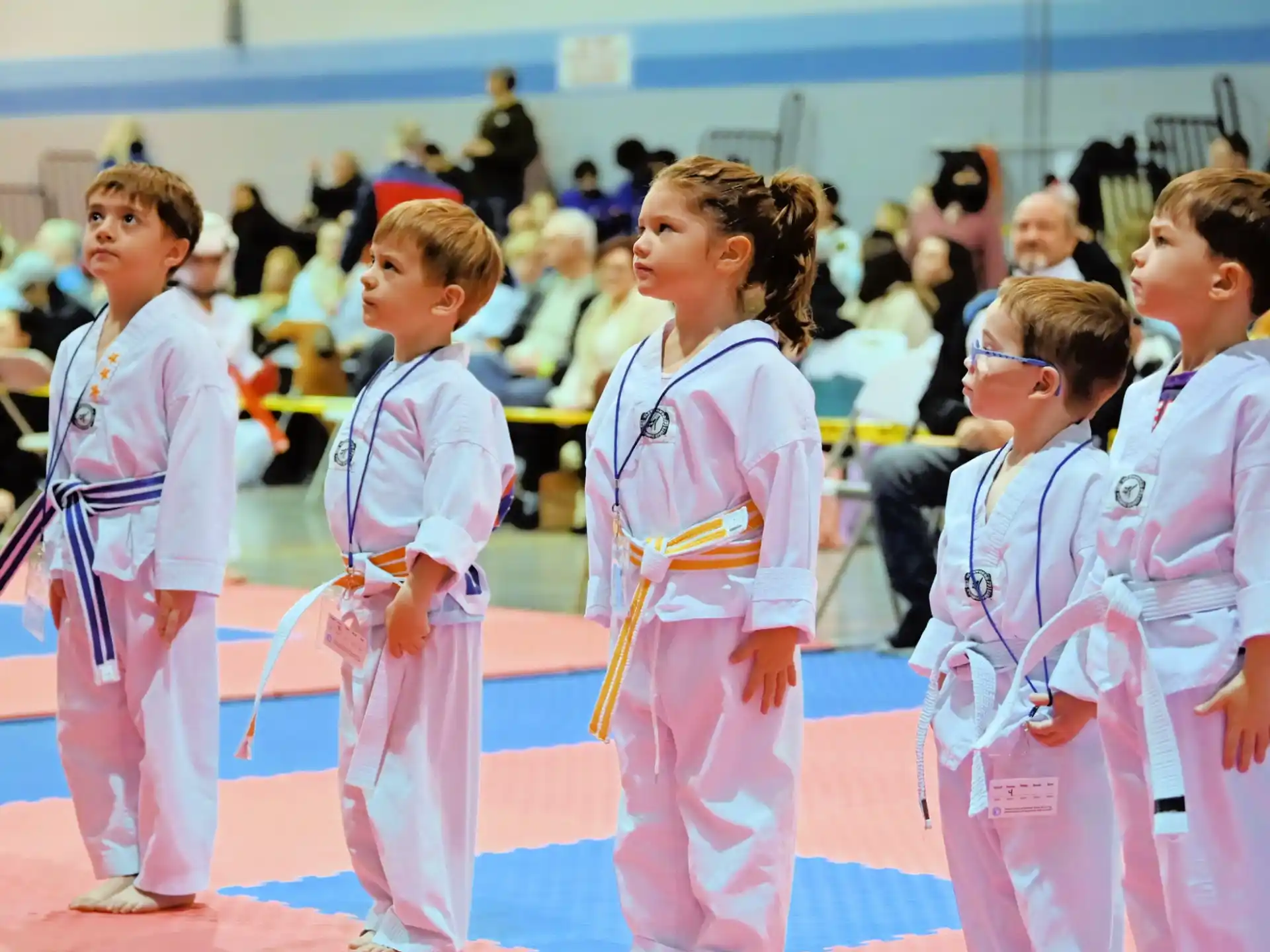 a group of children in matching outfits