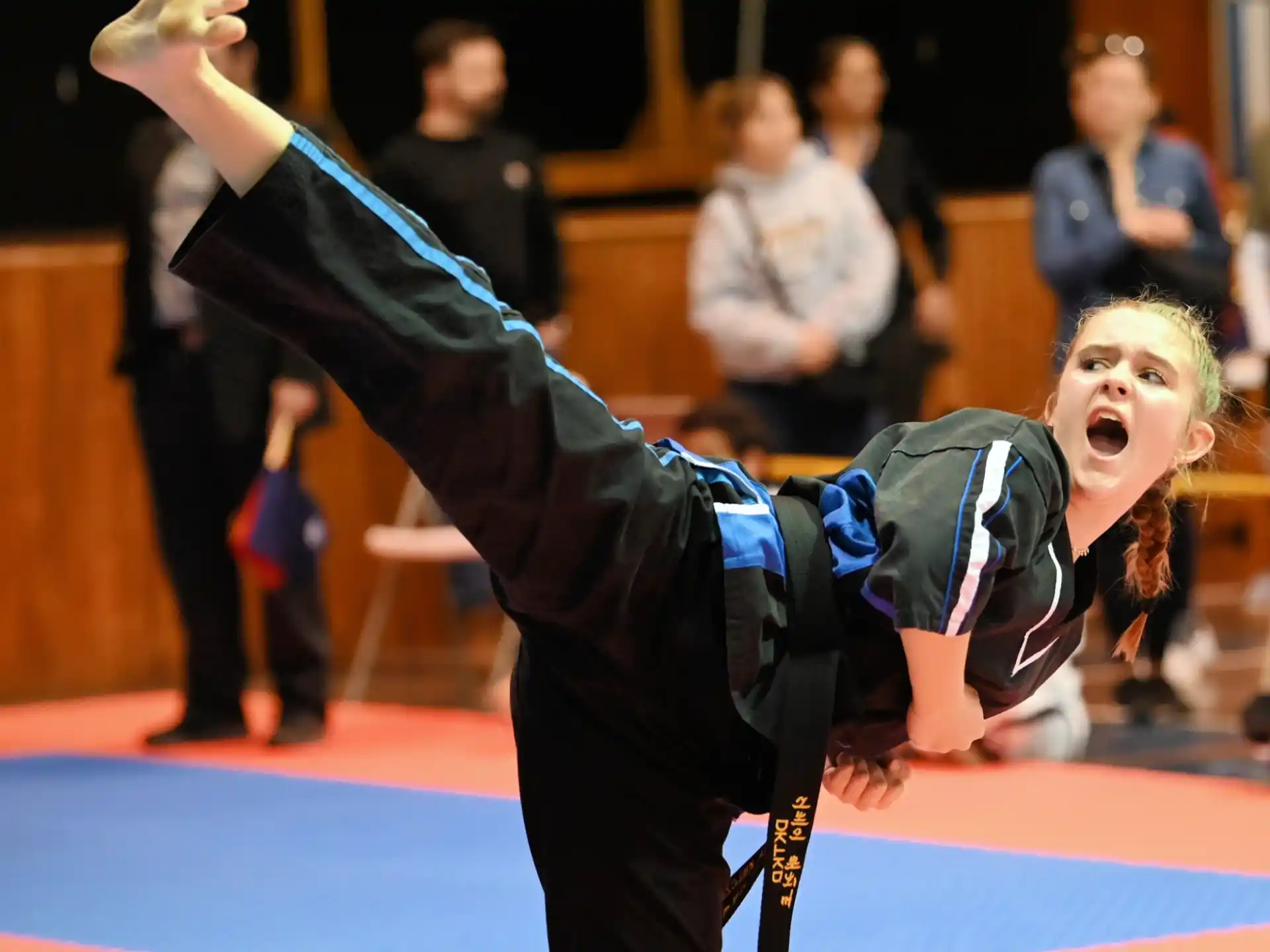 a person doing a handstand on a mat