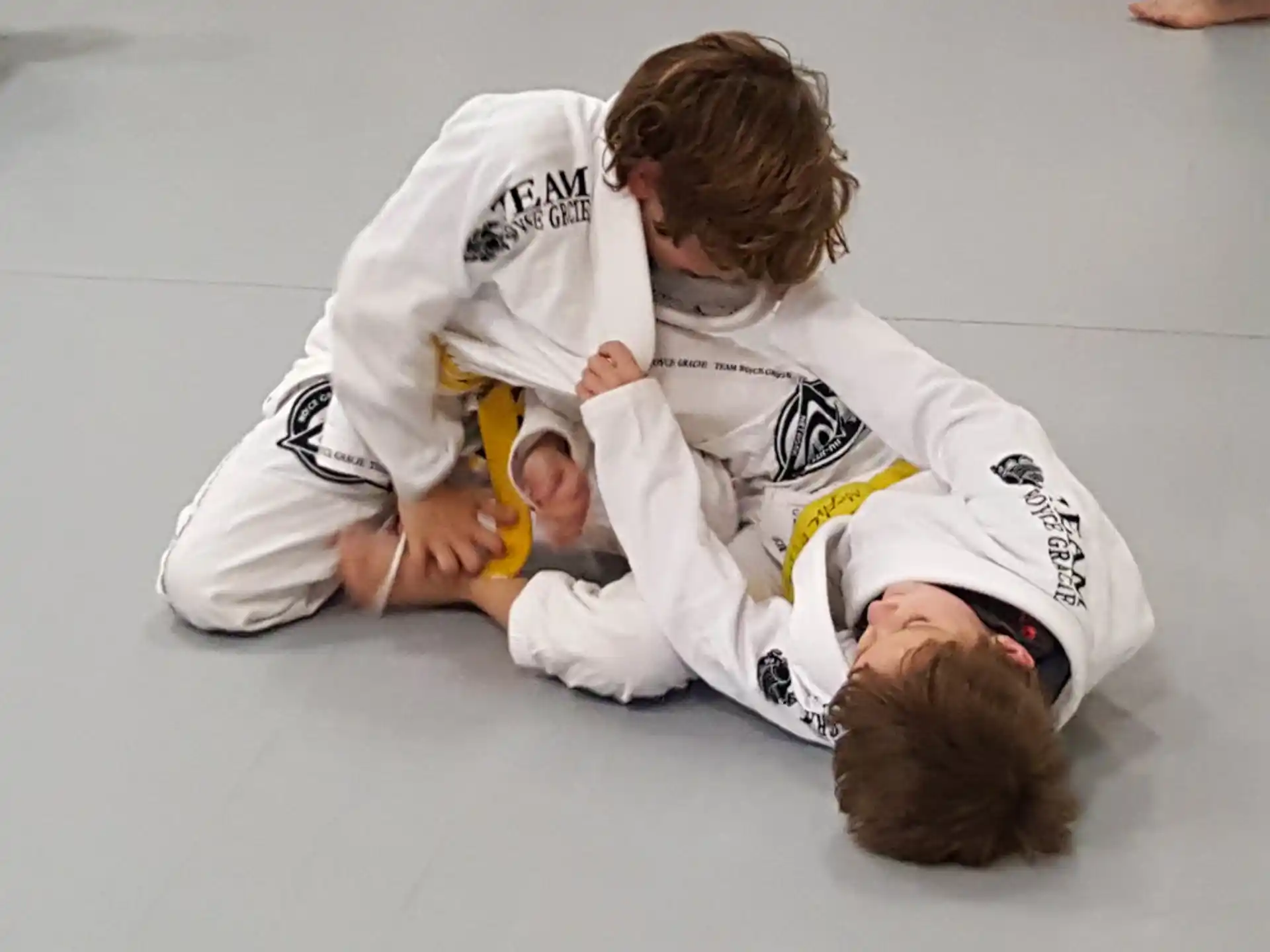 a couple of people in karate uniforms