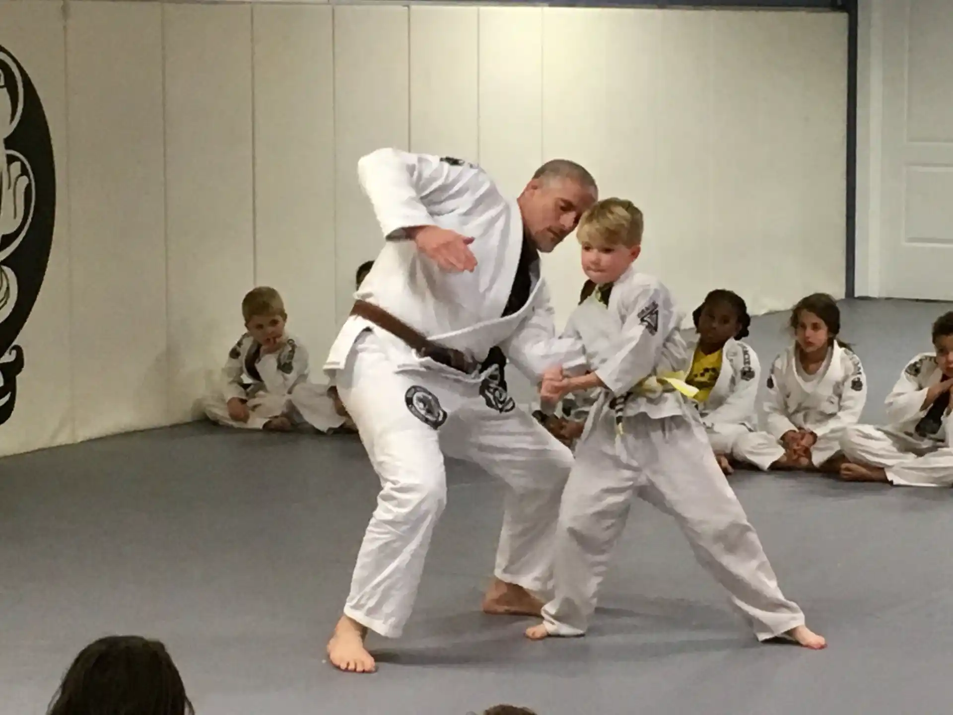 a group of people in karate uniforms