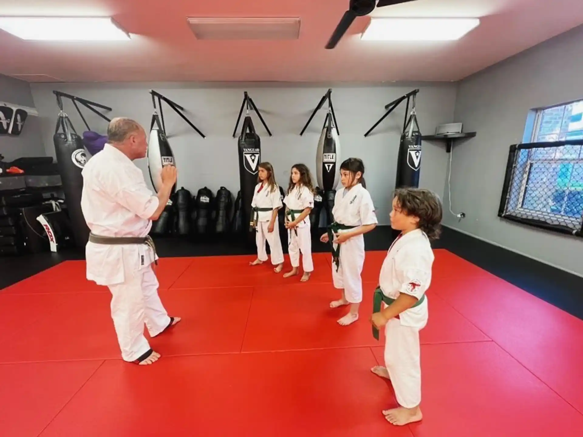 a group of people in karate uniforms