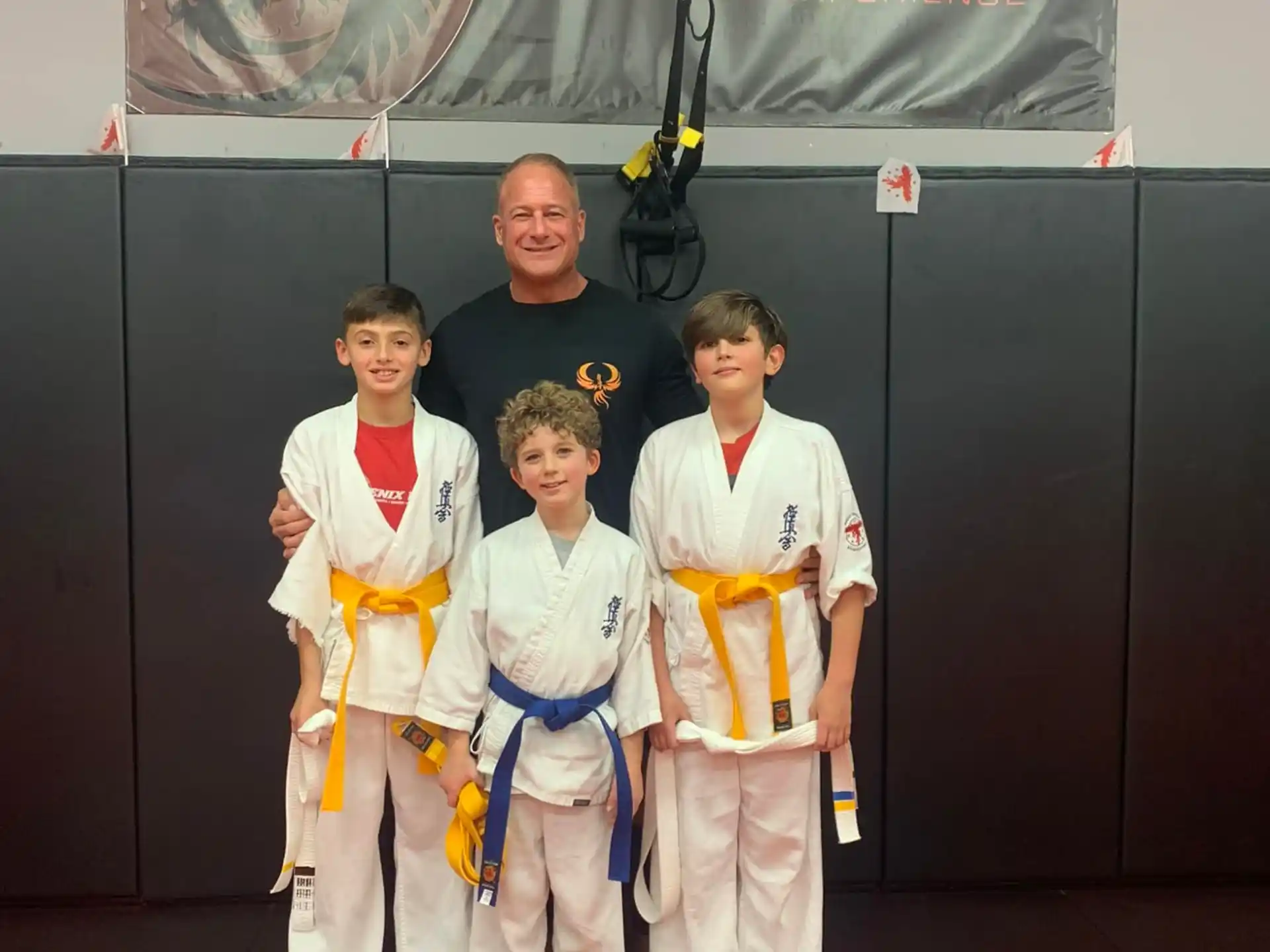 a group of people in karate uniforms