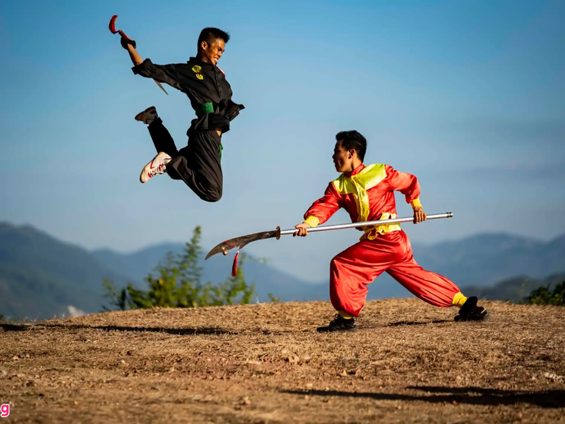 a man jumping over another man