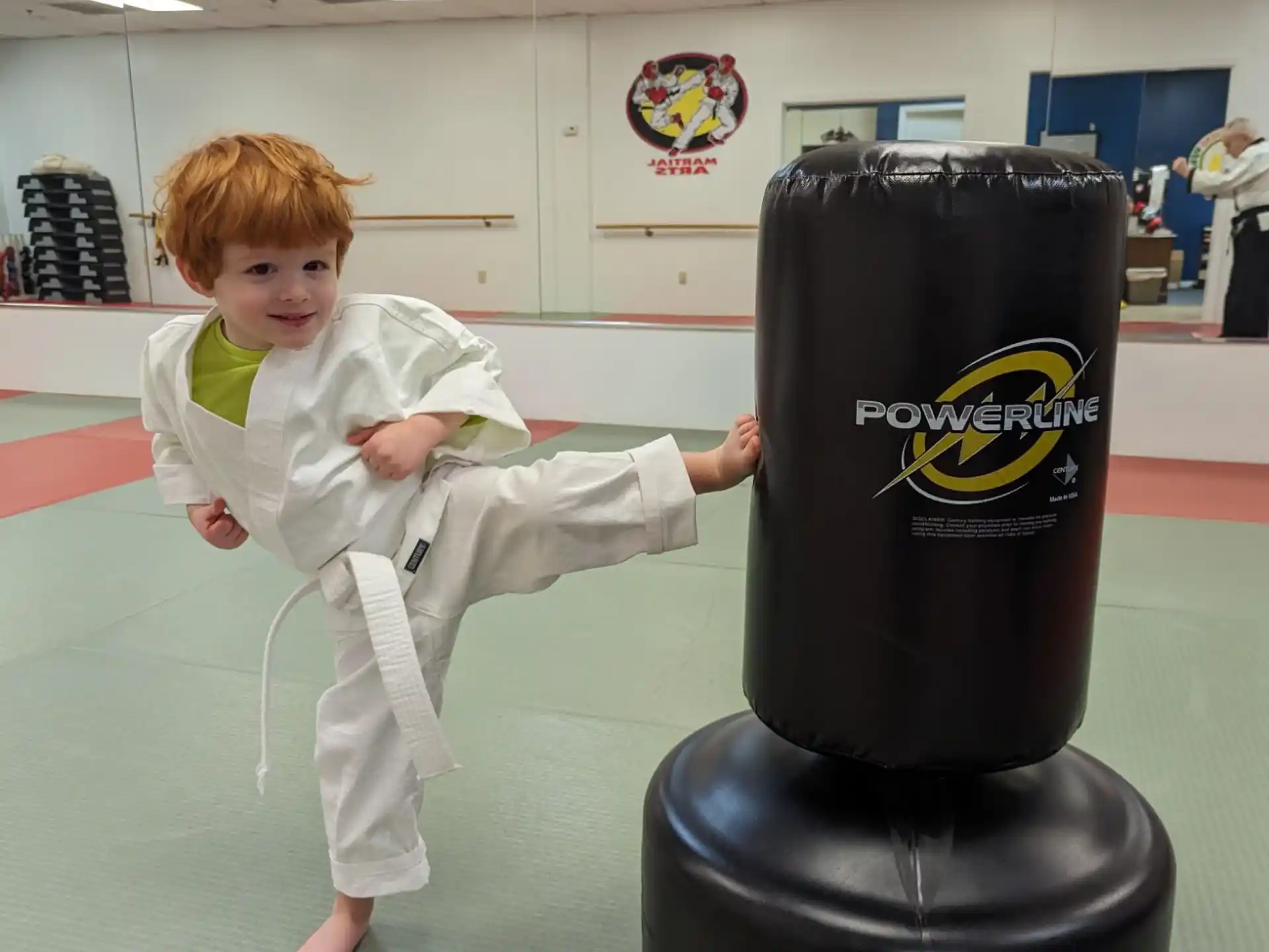 a child jumping on a black object
