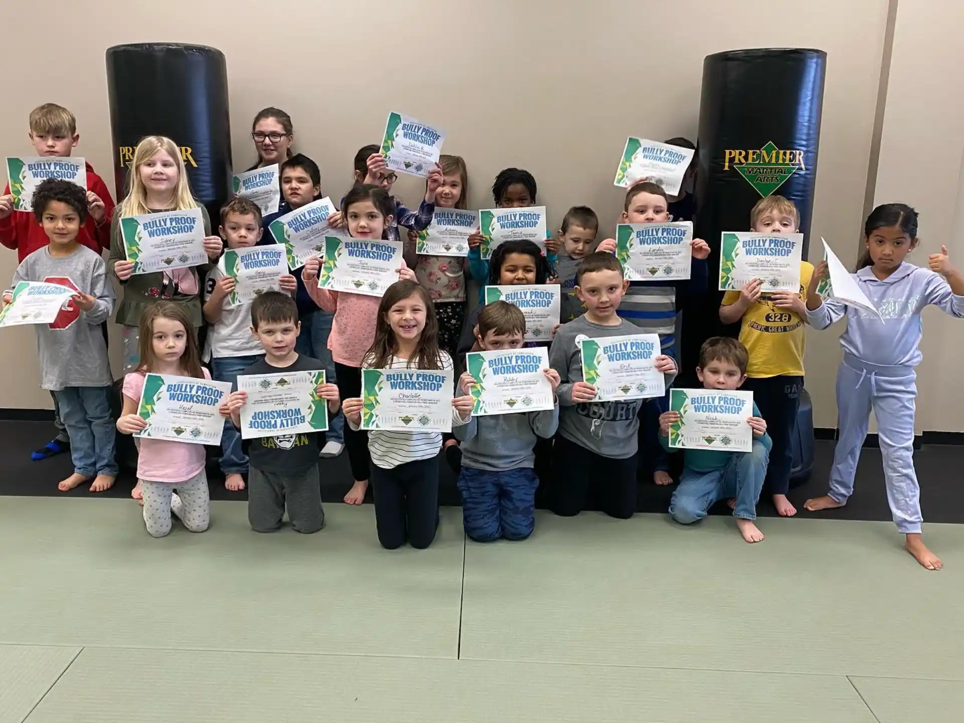 a group of children holding signs