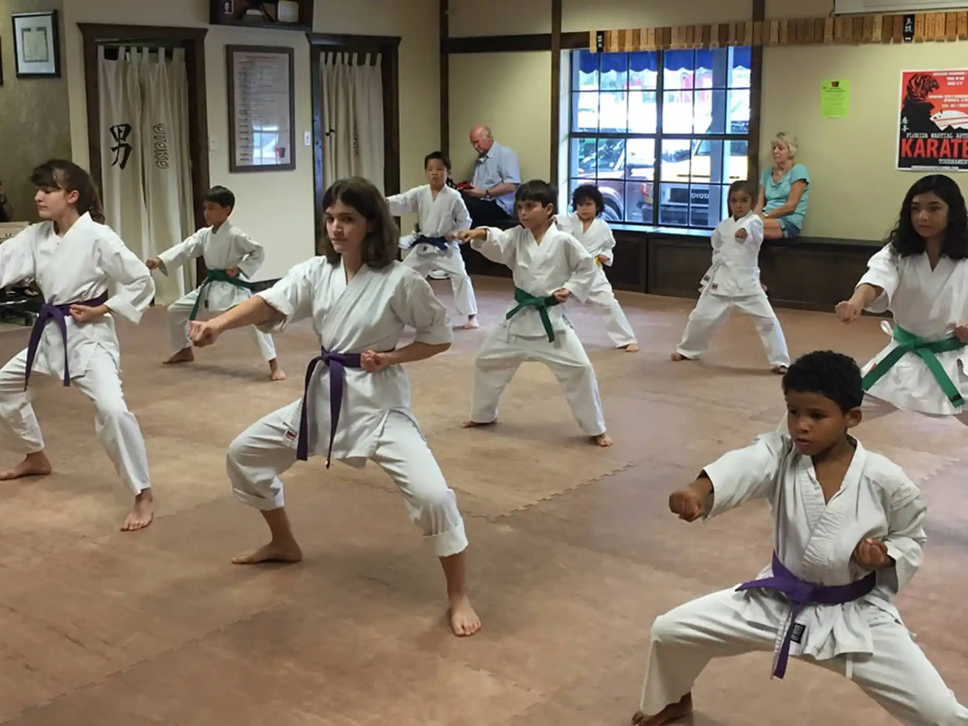 a group of people in karate uniforms