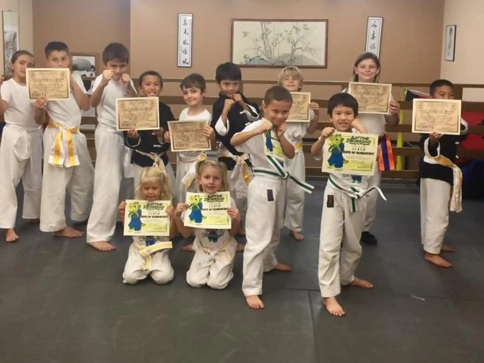 a group of children holding signs