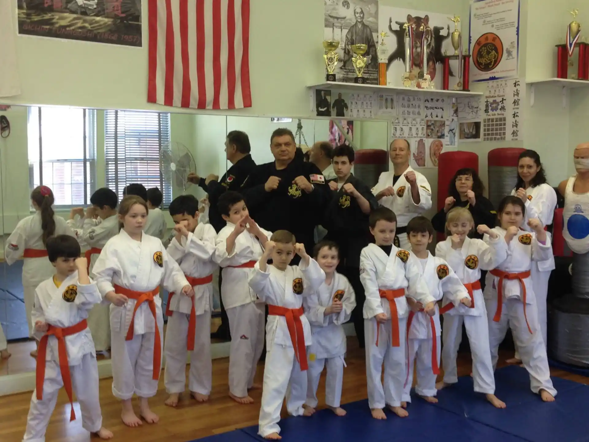 a group of people in karate uniforms