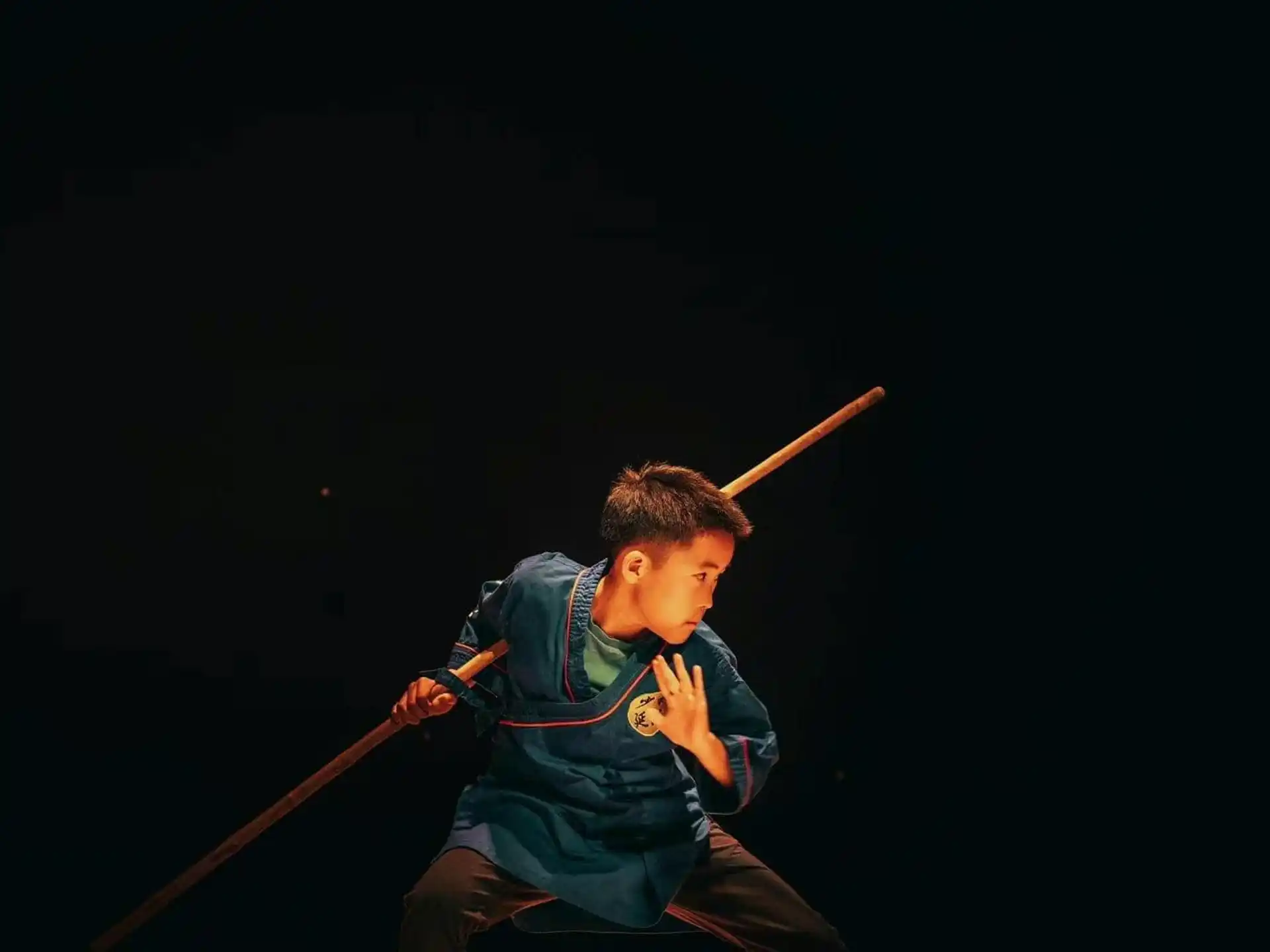 a boy holding a baseball bat