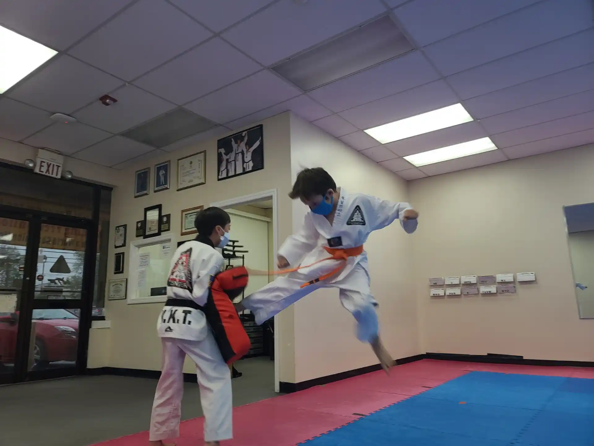 a couple of people in karate uniforms