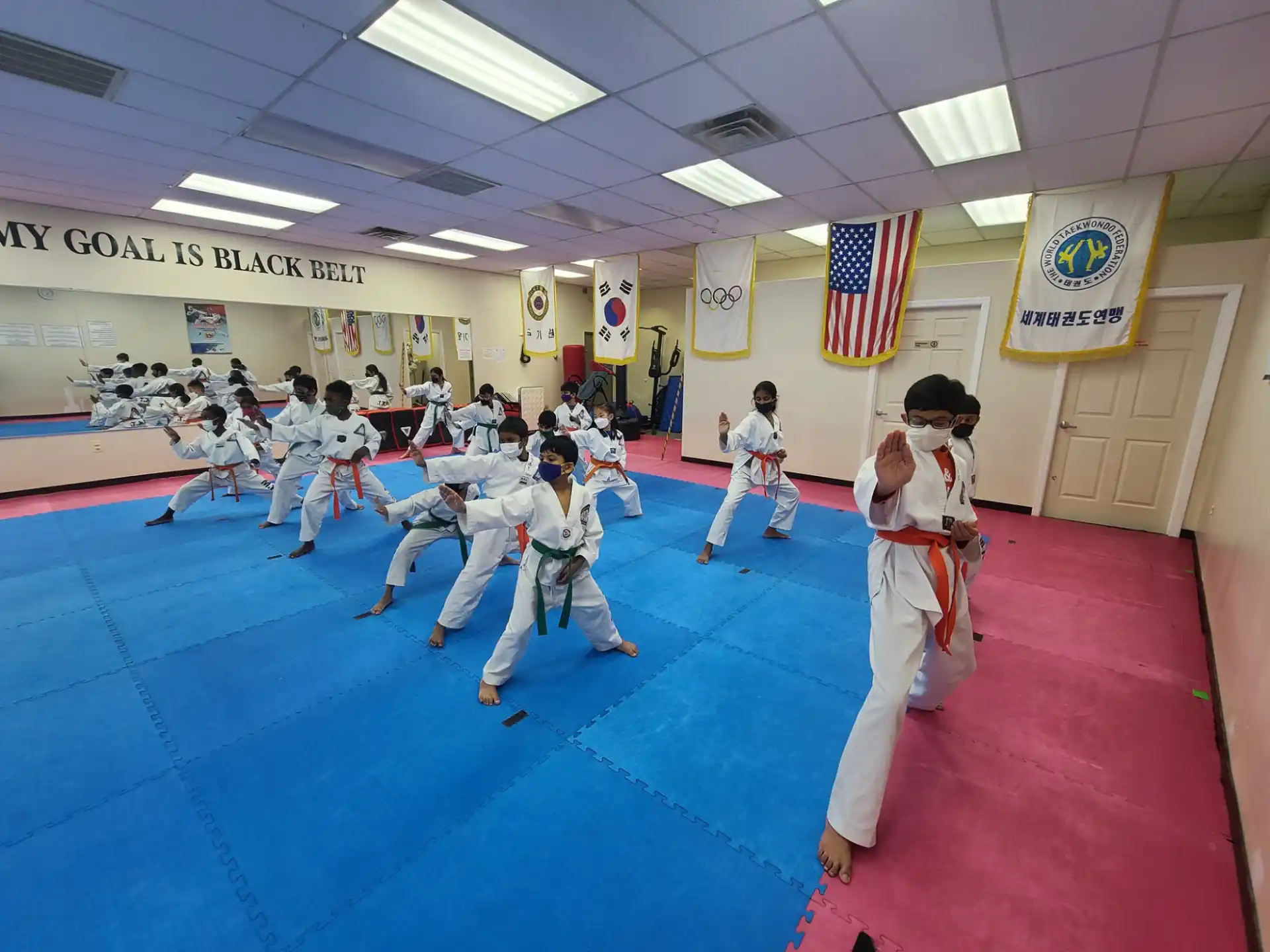 a group of people in karate uniforms