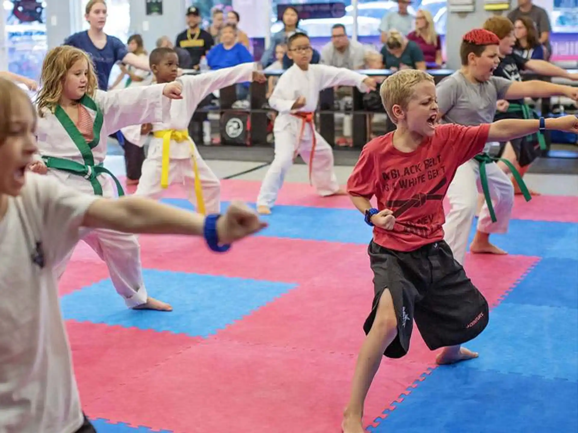 a group of children practicing martial arts