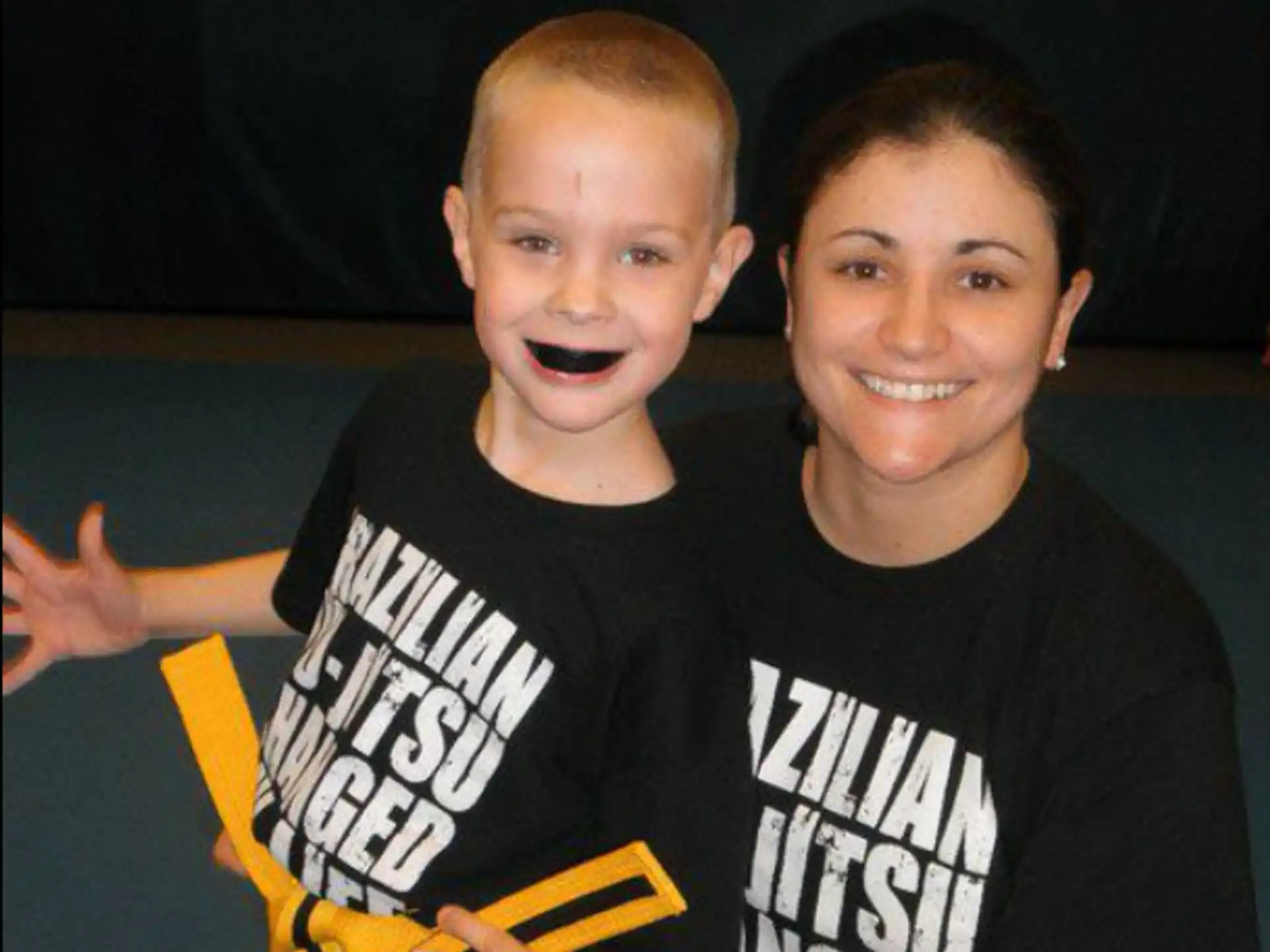 a person and a boy posing for a picture