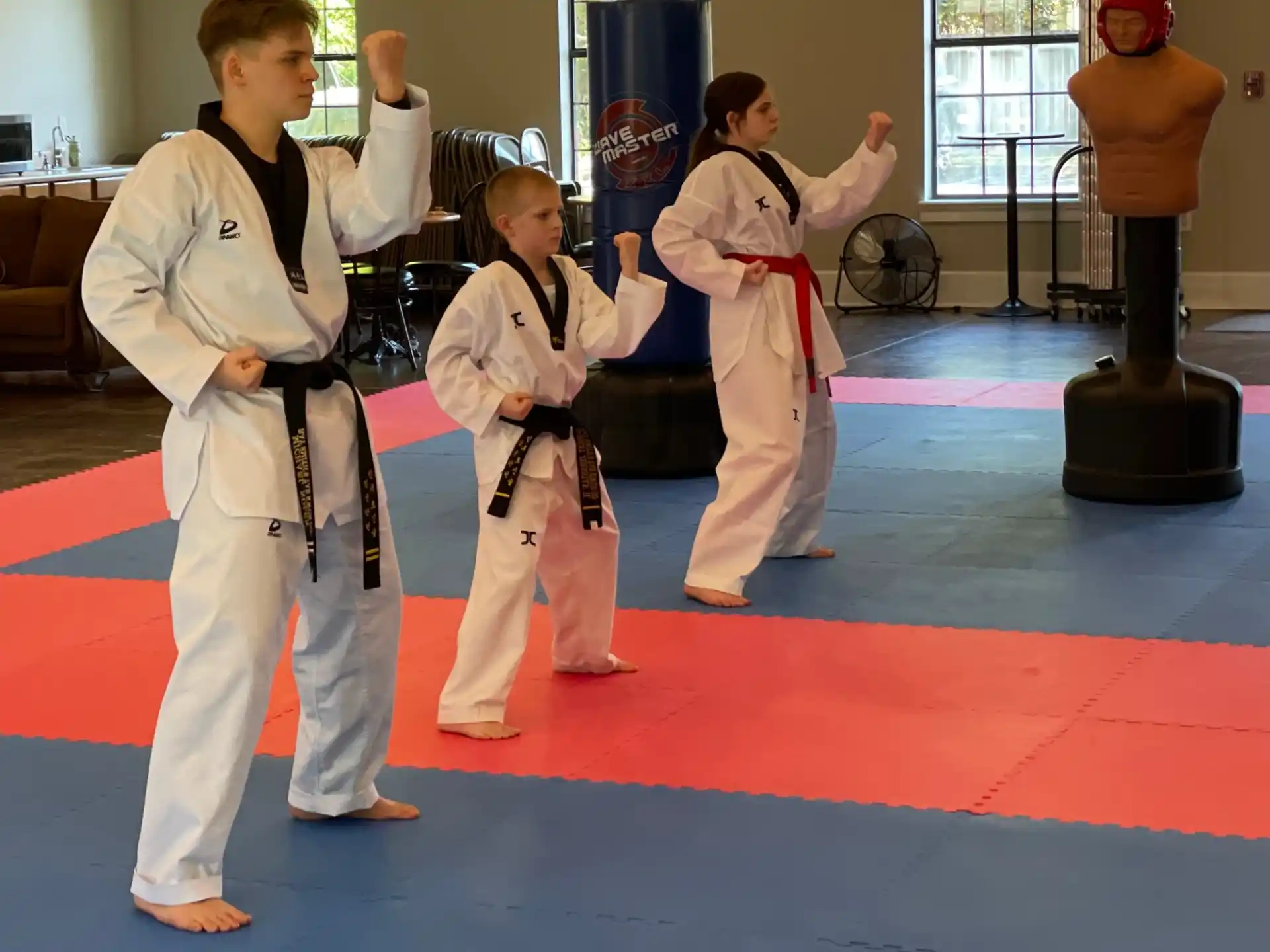 a group of children in karate uniforms