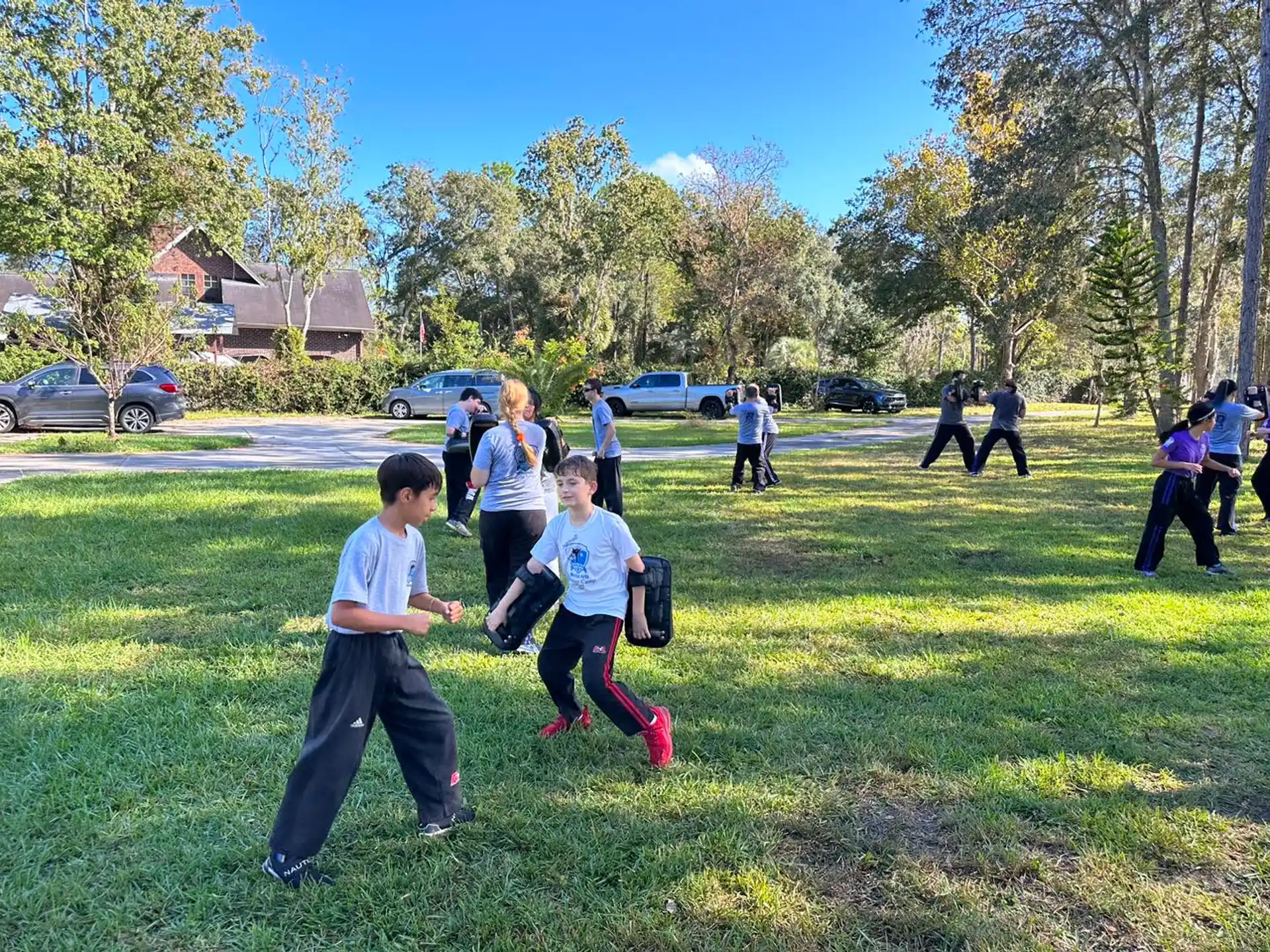 a group of people playing in a park