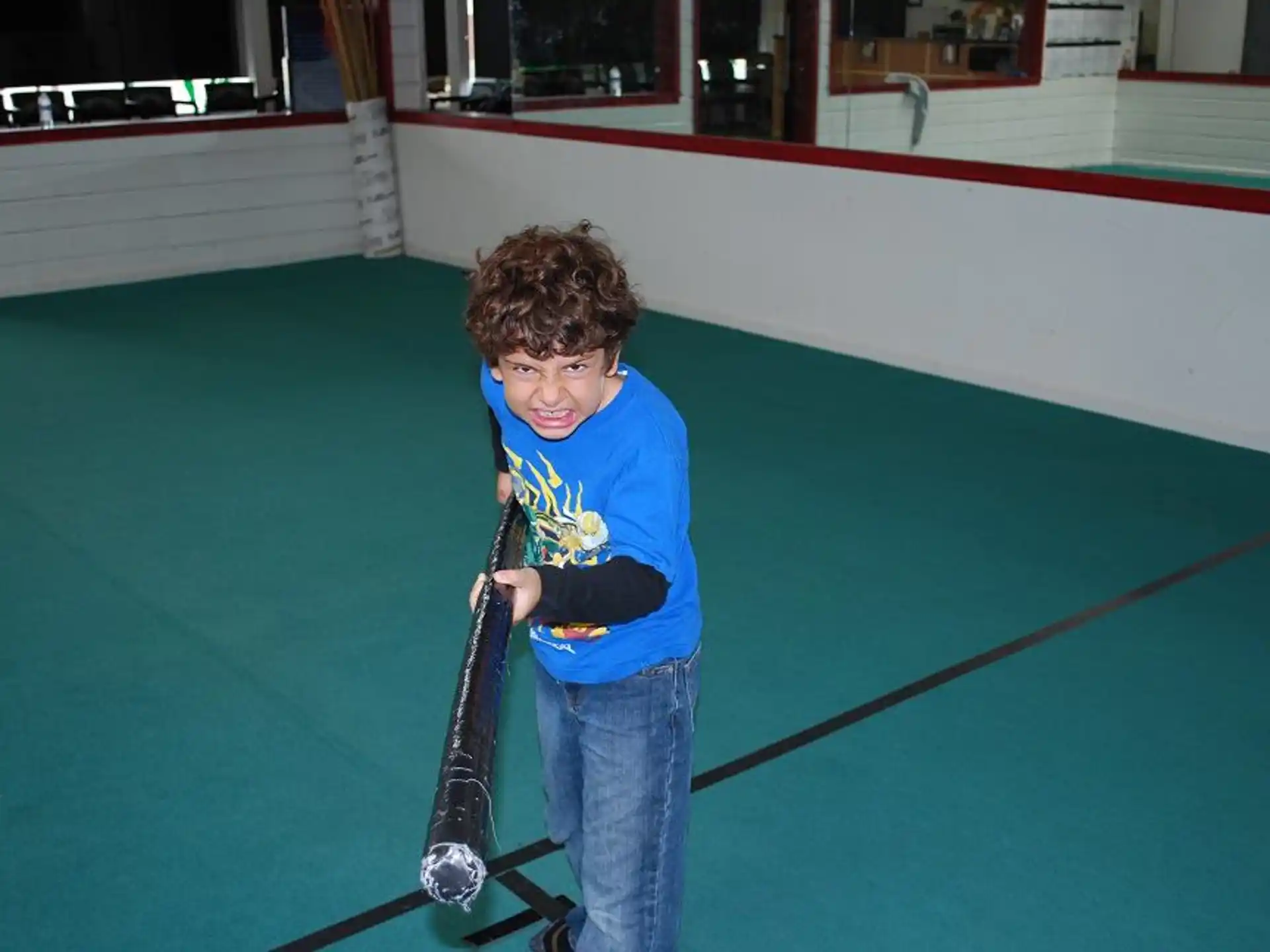 a boy holding a golf club