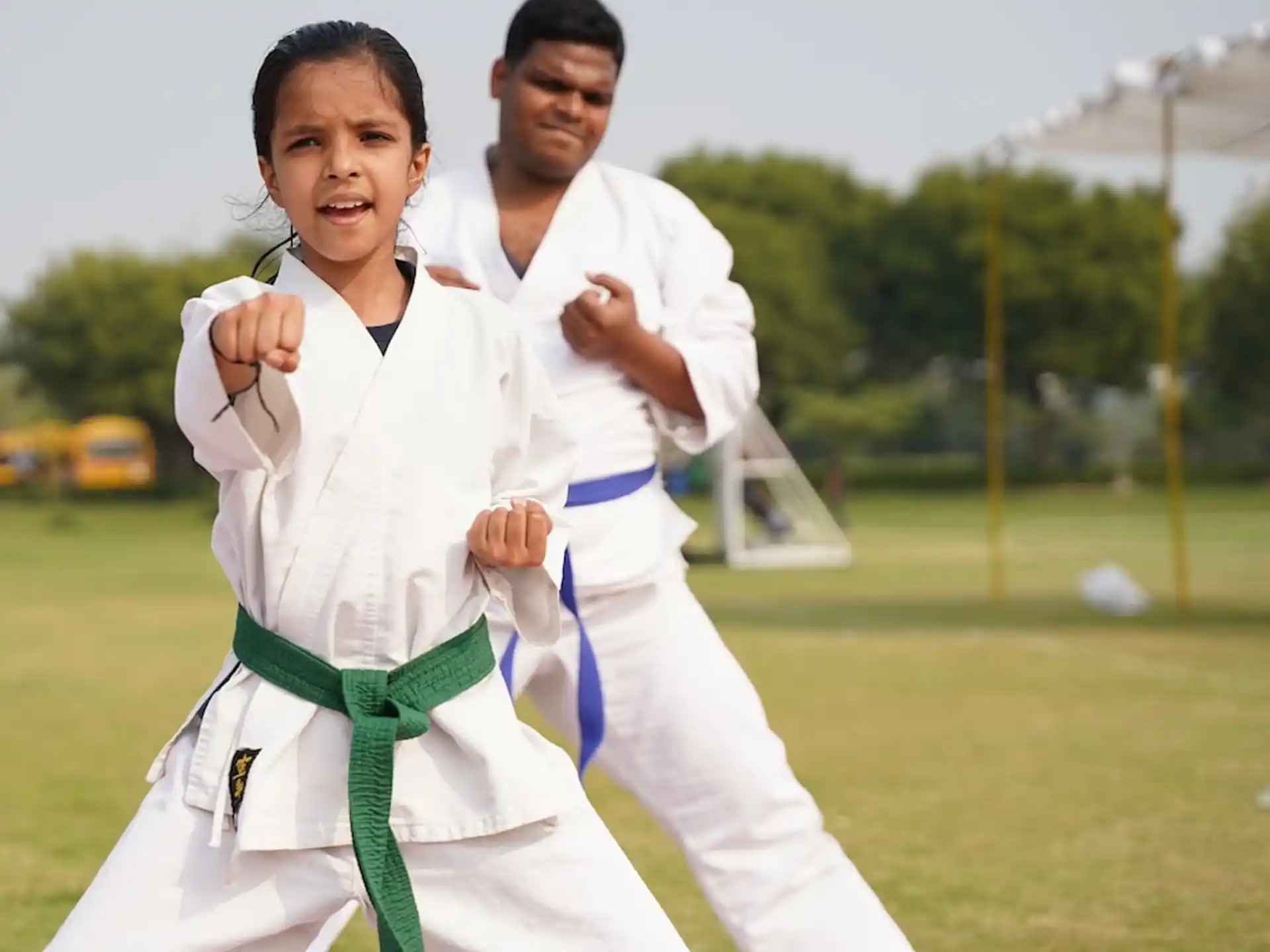 a man and a woman in karate uniforms