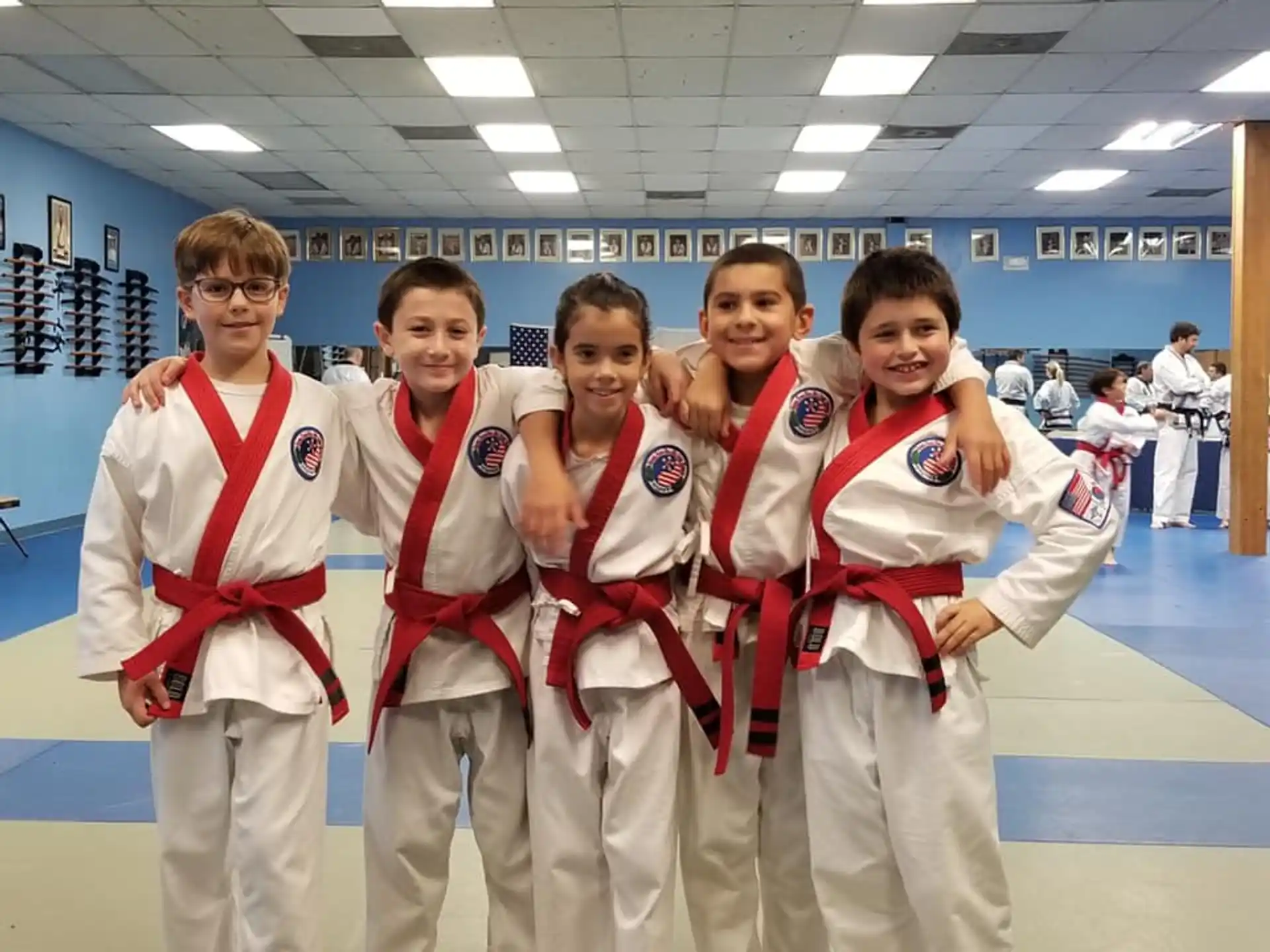 a group of kids in karate uniforms