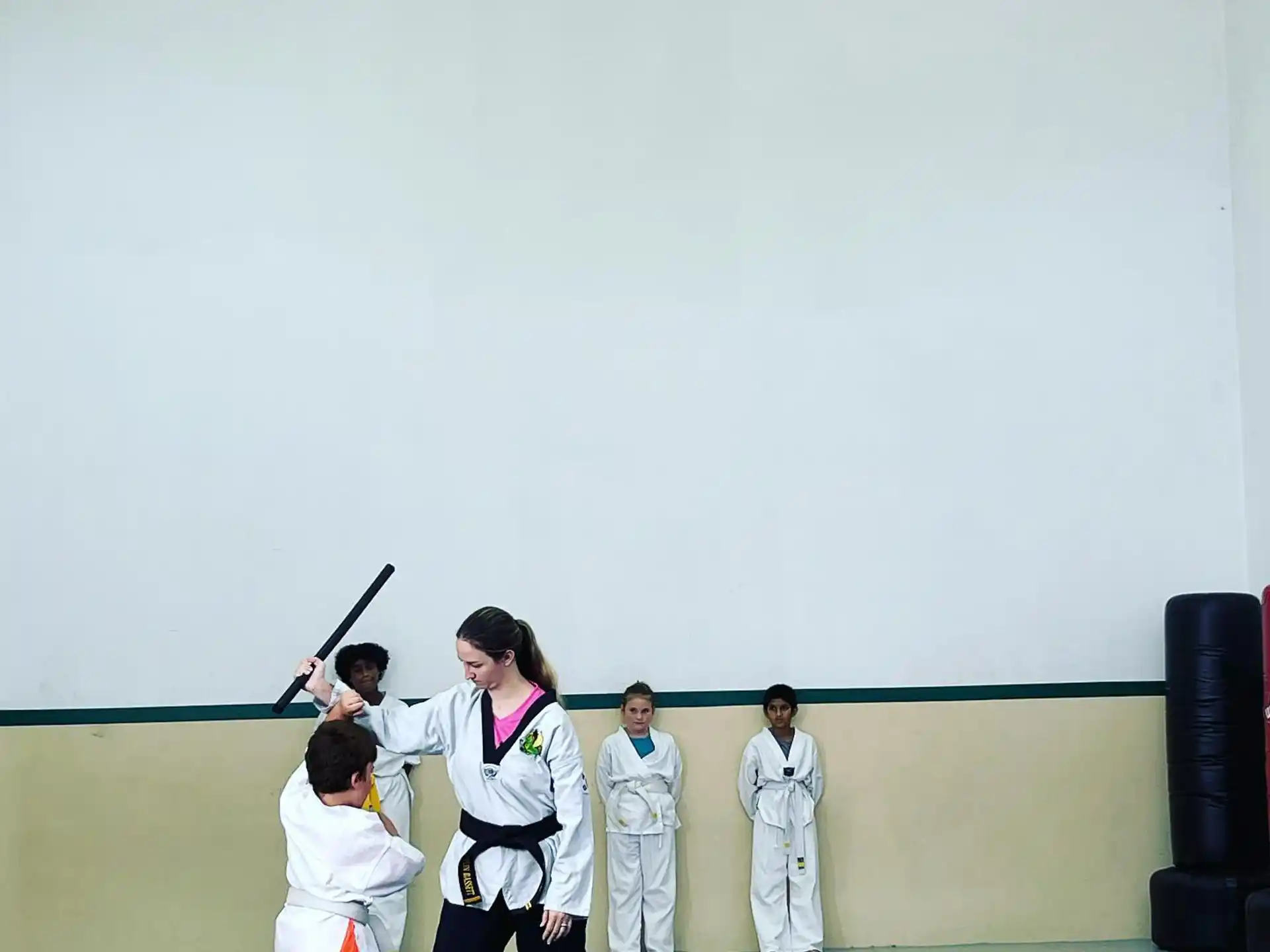 a group of people in karate uniforms