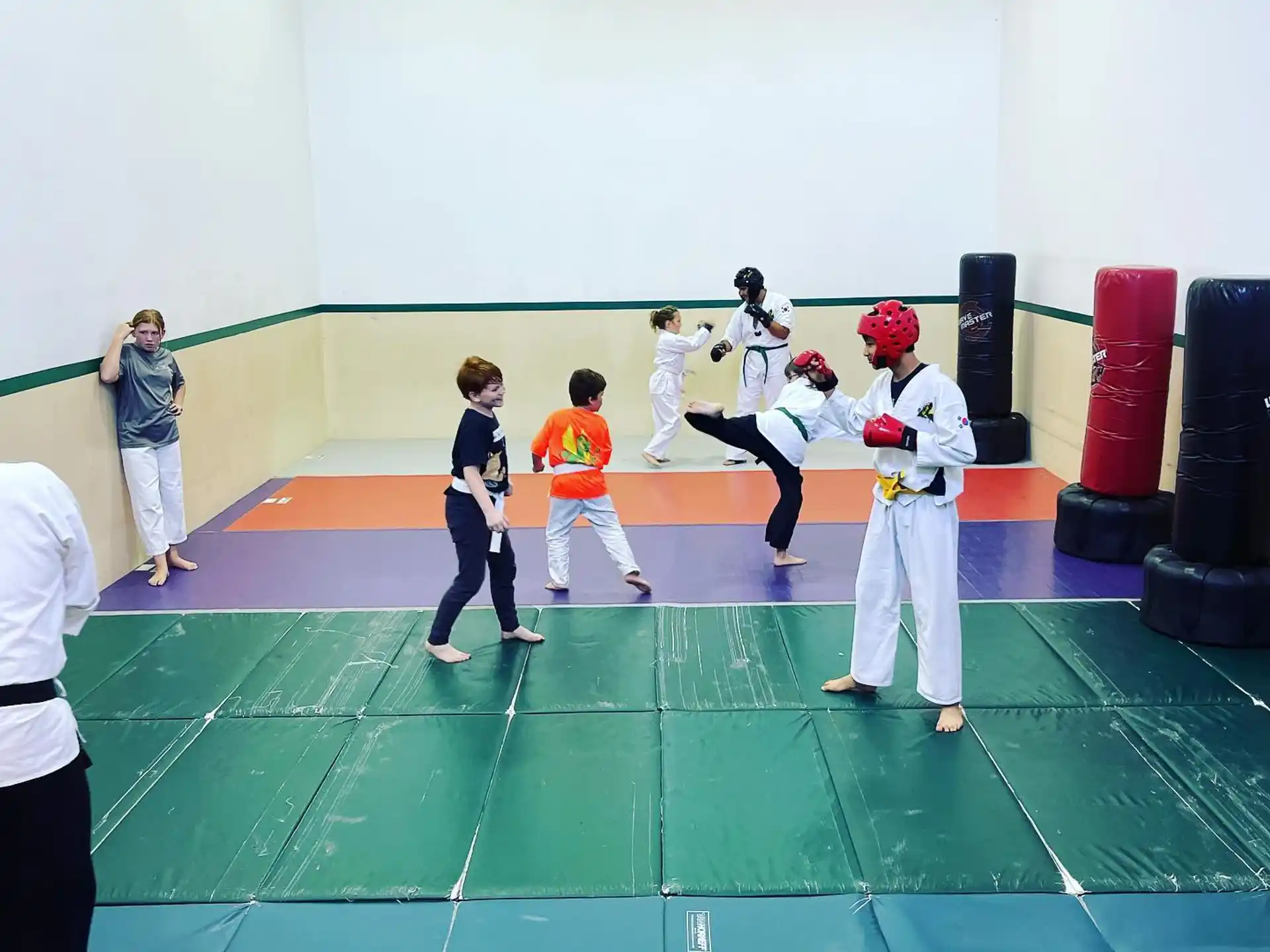 a group of people in karate uniforms